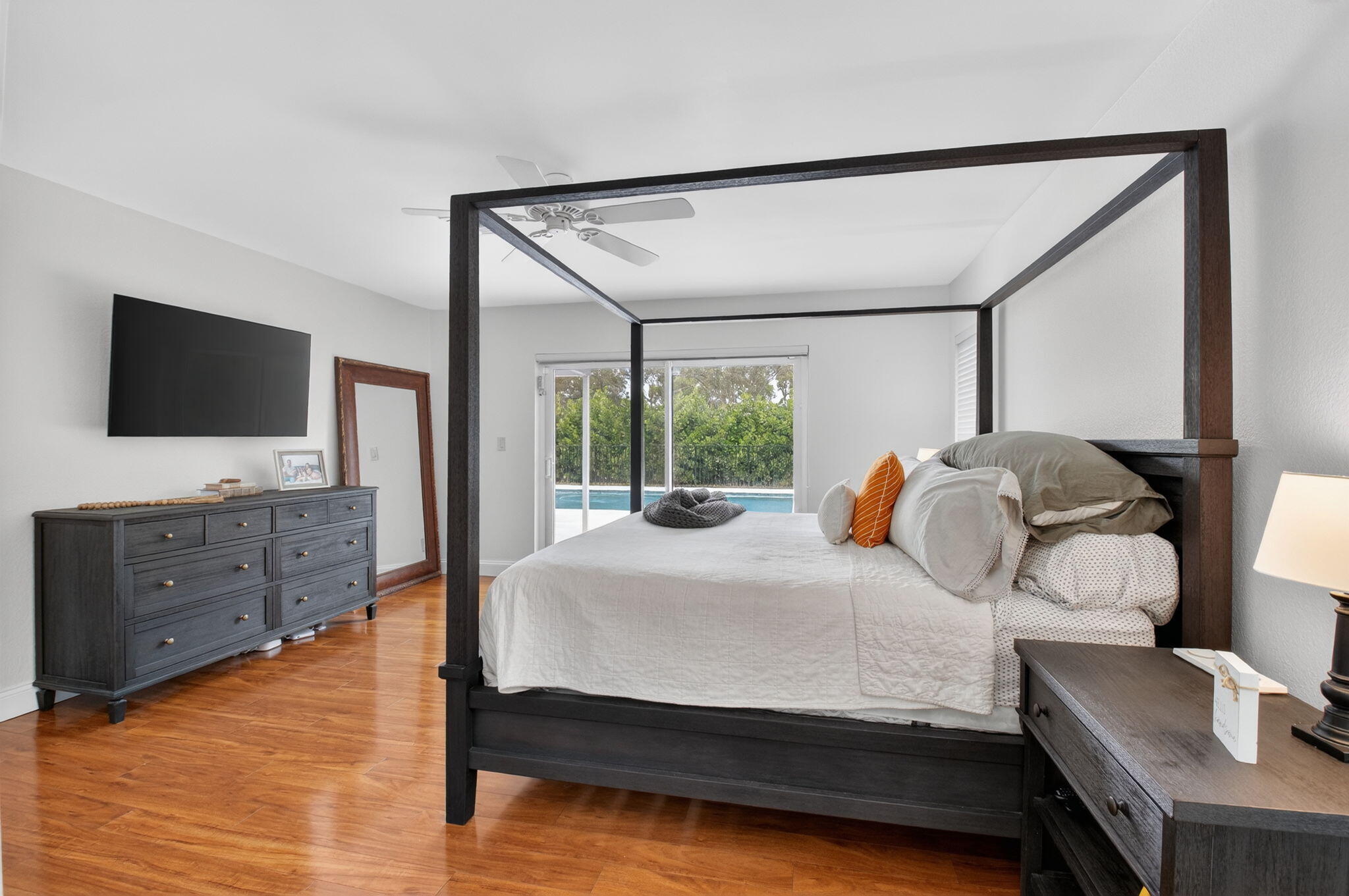 10302 Crosswind Road Boca Raton, FL 33498 - Photo 17 of 27 a bedroom with a bed and a flat screen tv