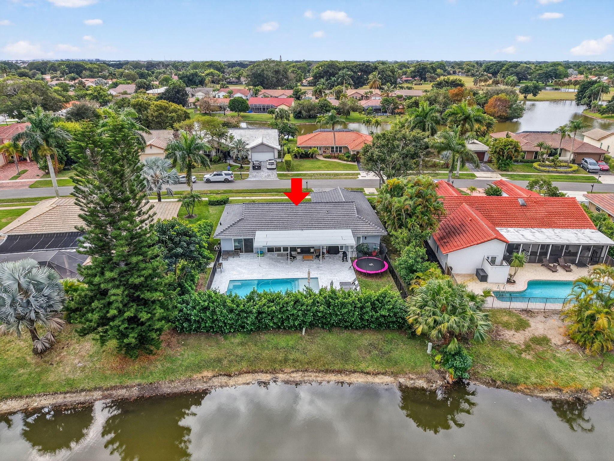 10302 Crosswind Road Boca Raton, FL 33498 - Photo 24 of 27 an aerial view of residential houses with outdoor space and lake view