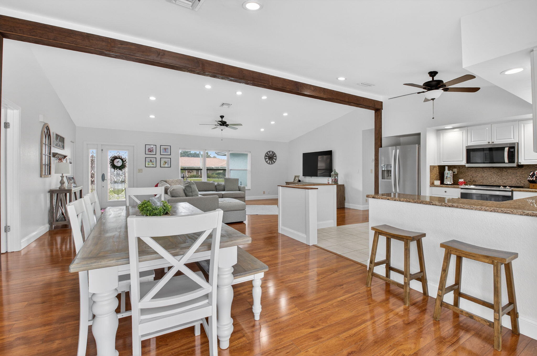 10302 Crosswind Road Boca Raton, FL 33498 - Photo 5 of 27 a view of kitchen with cabinets and wooden floor