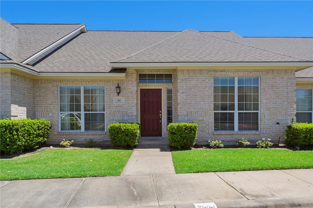 116 Fraternity Row College Station, TX 77845 - Photo 1 of 1 a front view of a house with a garden