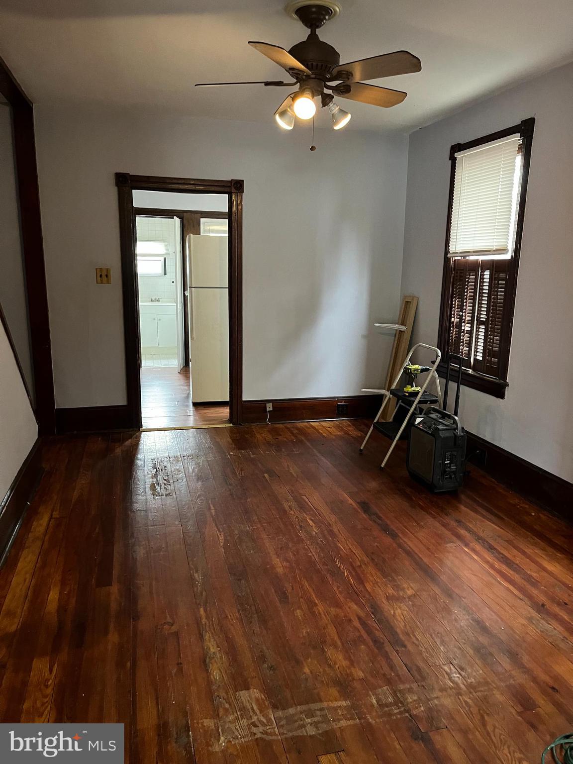 425 Taylor Street Riverside, NJ 08075 - Photo 5 of 9 a view of an empty room with wooden floor and a window