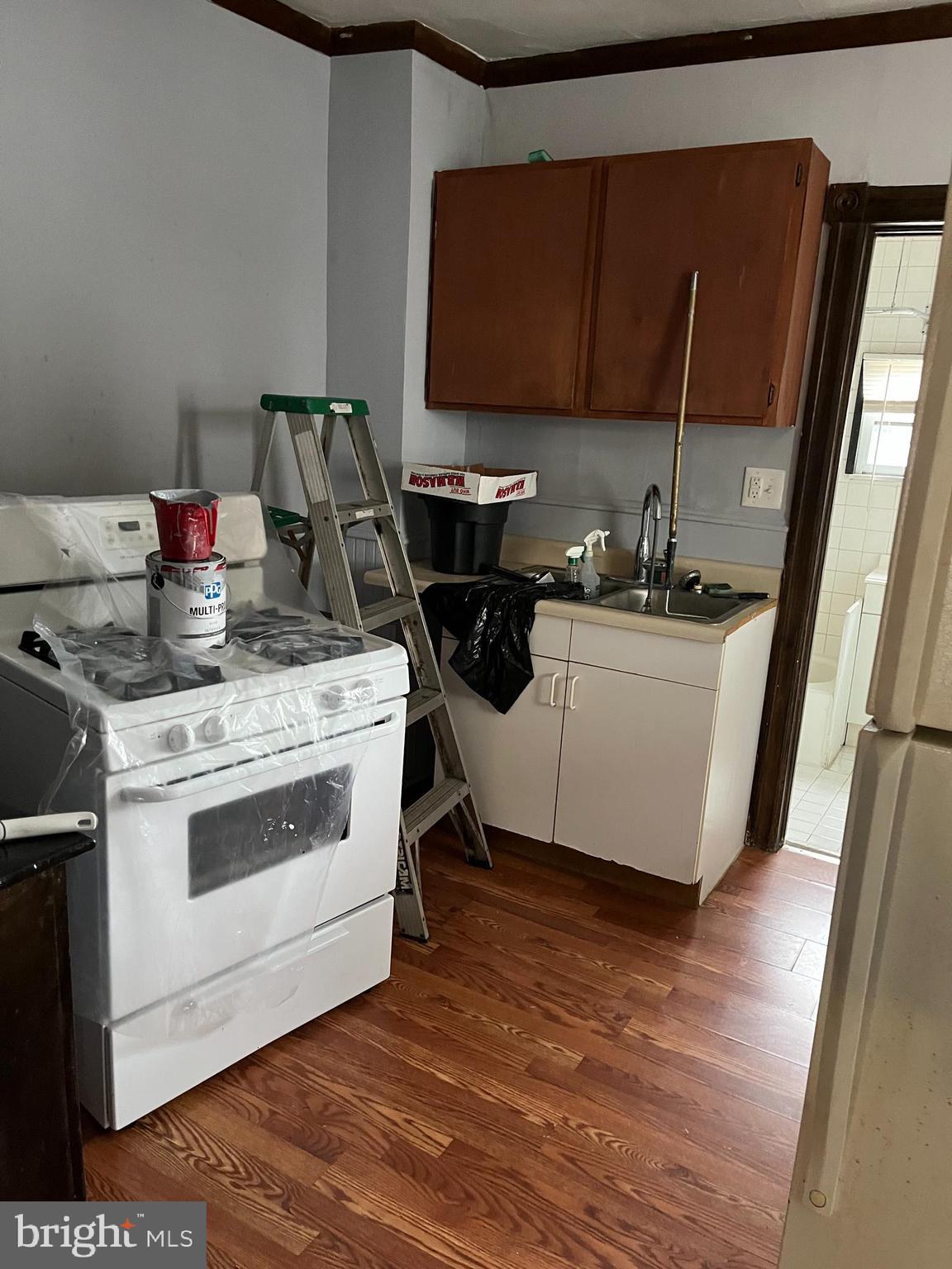 425 Taylor Street Riverside, NJ 08075 - Photo 6 of 9 a kitchen with a sink stove and cabinets