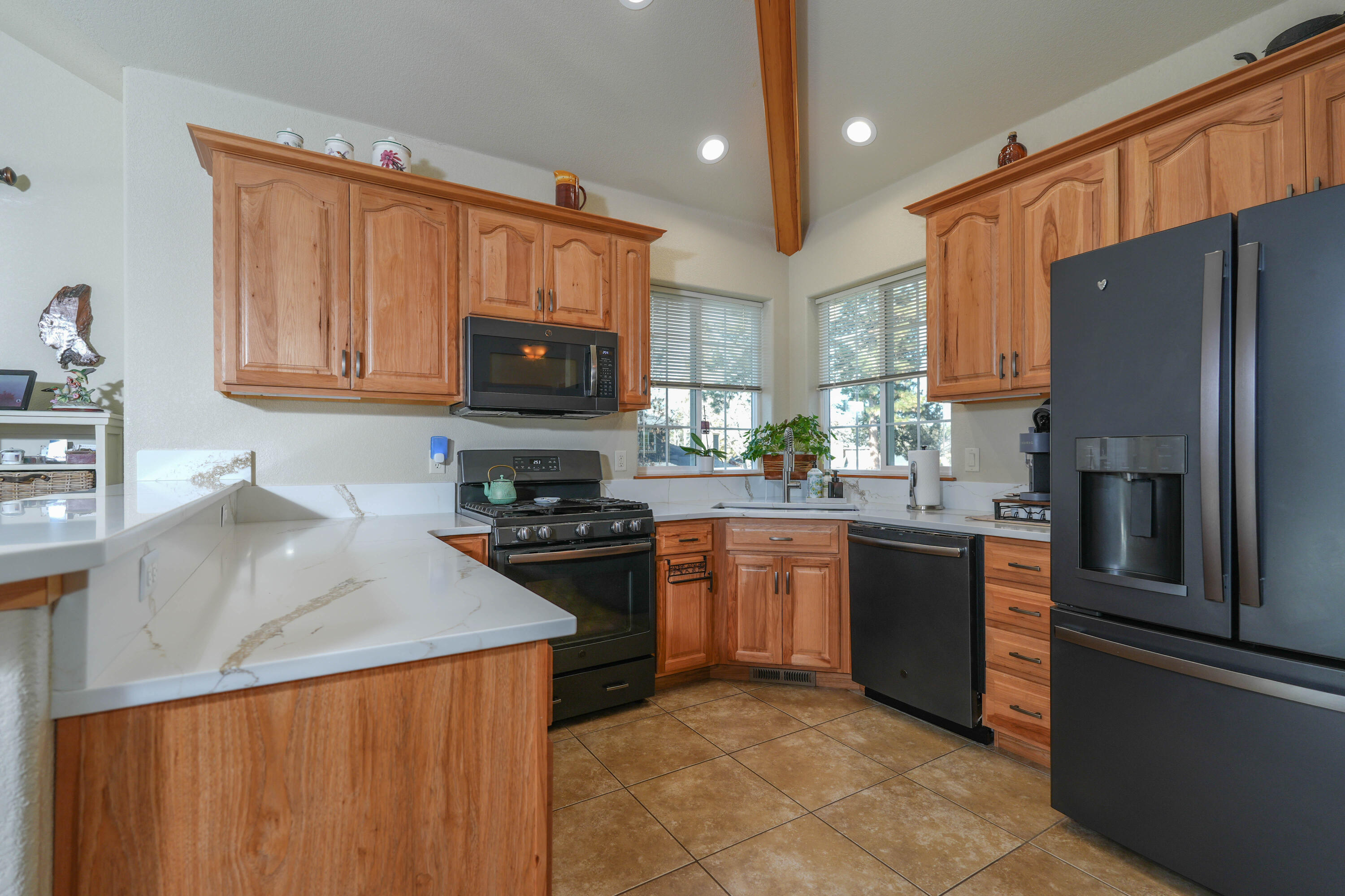 5028 Sora Loop Klamath Falls, OR 97601 - Photo 11 of 62 a kitchen with granite countertop stainless steel appliances and wooden cabinets
