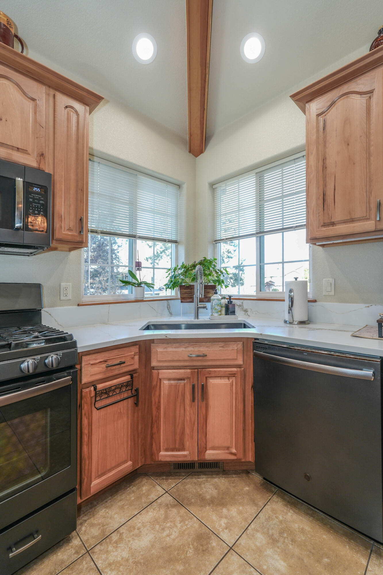 5028 Sora Loop Klamath Falls, OR 97601 - Photo 14 of 62 a kitchen with stainless steel appliances granite countertop a stove sink and microwave