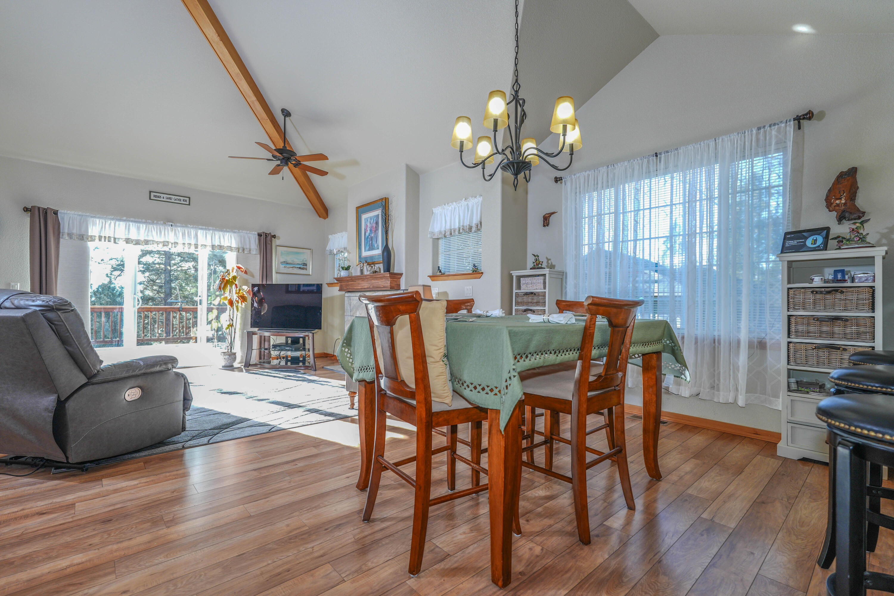 5028 Sora Loop Klamath Falls, OR 97601 - Photo 18 of 62 a view of a dining room with furniture wooden floor and chandelier
