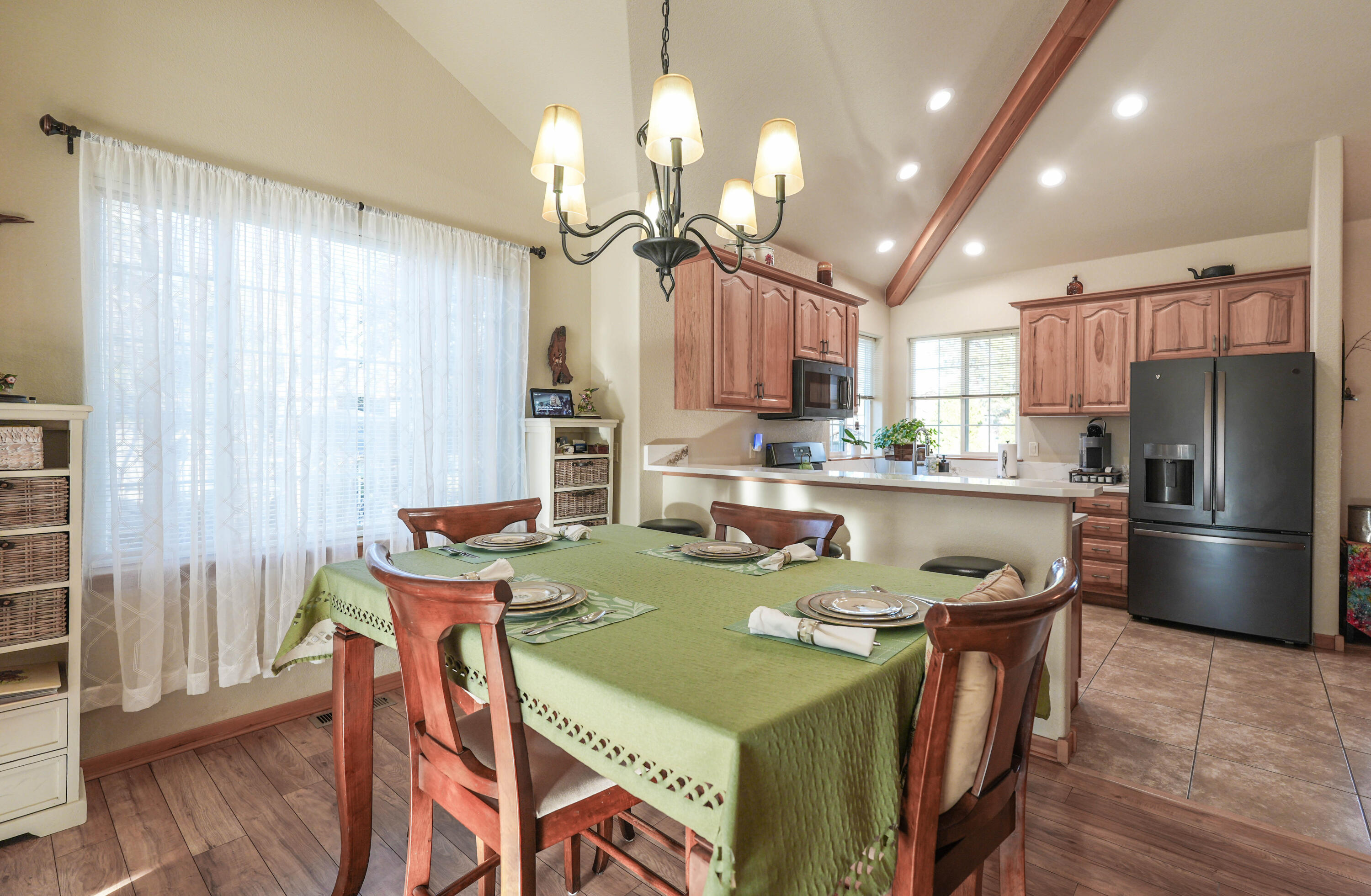 5028 Sora Loop Klamath Falls, OR 97601 - Photo 21 of 62 a kitchen with kitchen island a dining table and chairs