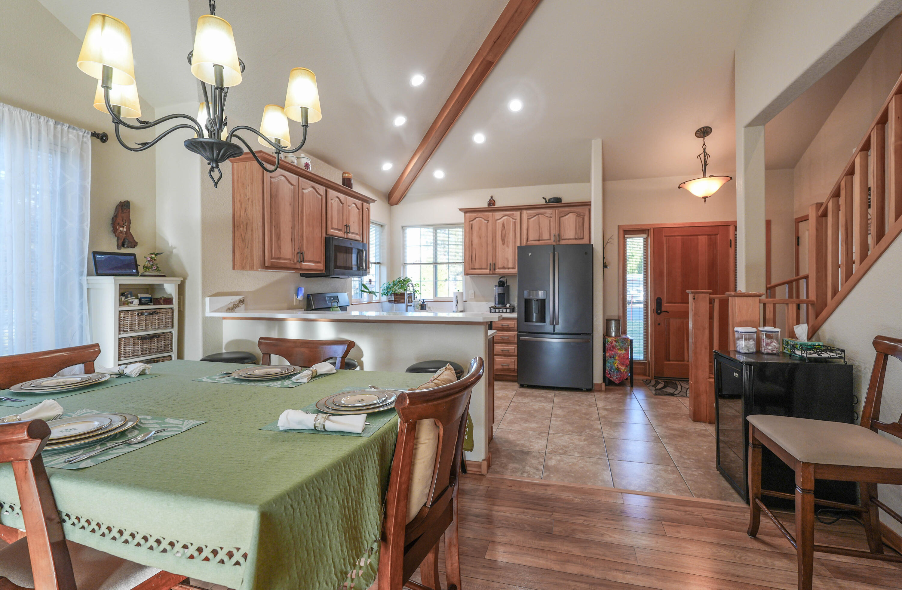 5028 Sora Loop Klamath Falls, OR 97601 - Photo 22 of 62 a kitchen with stainless steel appliances granite countertop a sink a stove a refrigerator cabinets and chairs