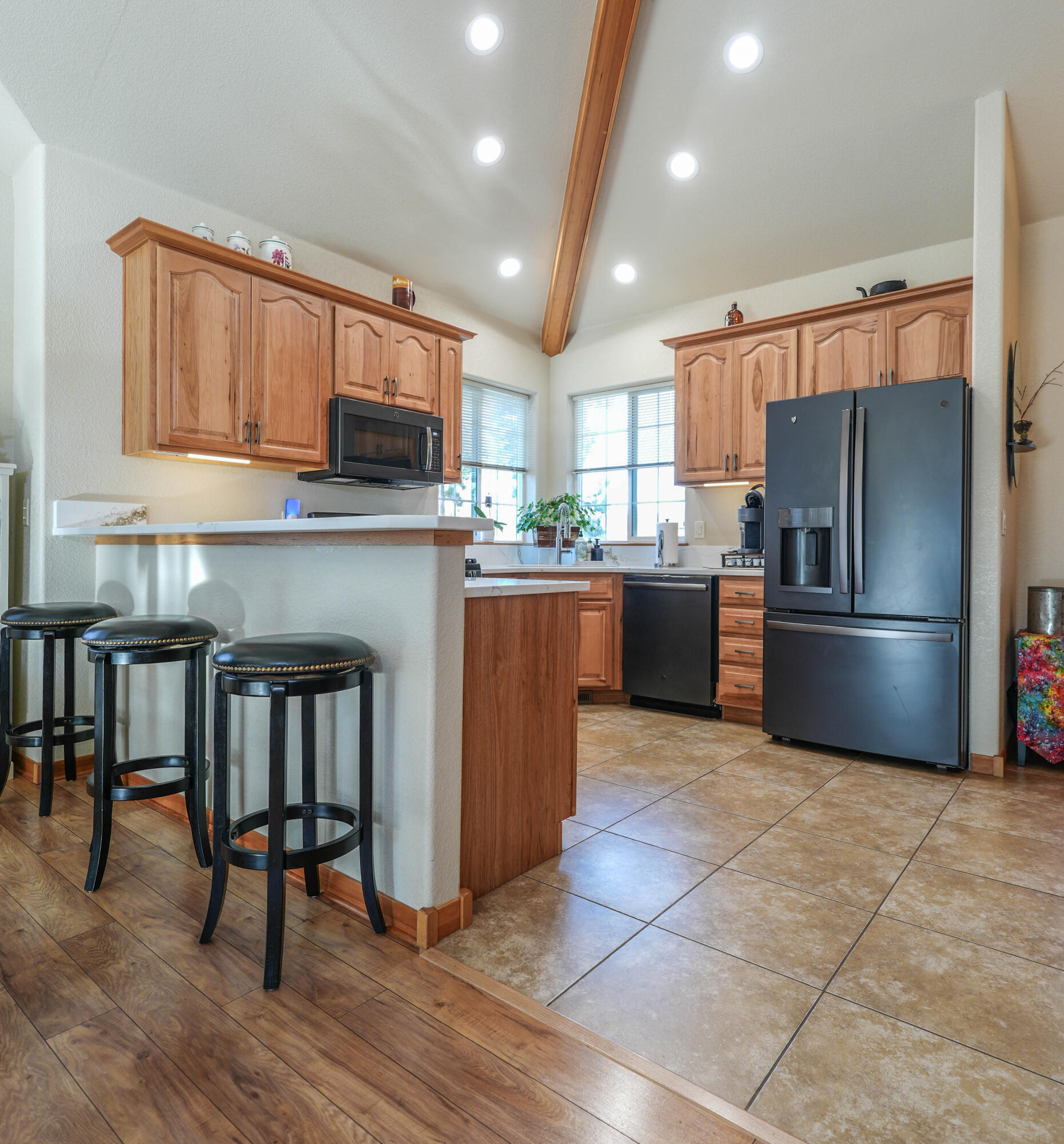 5028 Sora Loop Klamath Falls, OR 97601 - Photo 23 of 62 a kitchen with granite countertop a stove top oven and refrigerator
