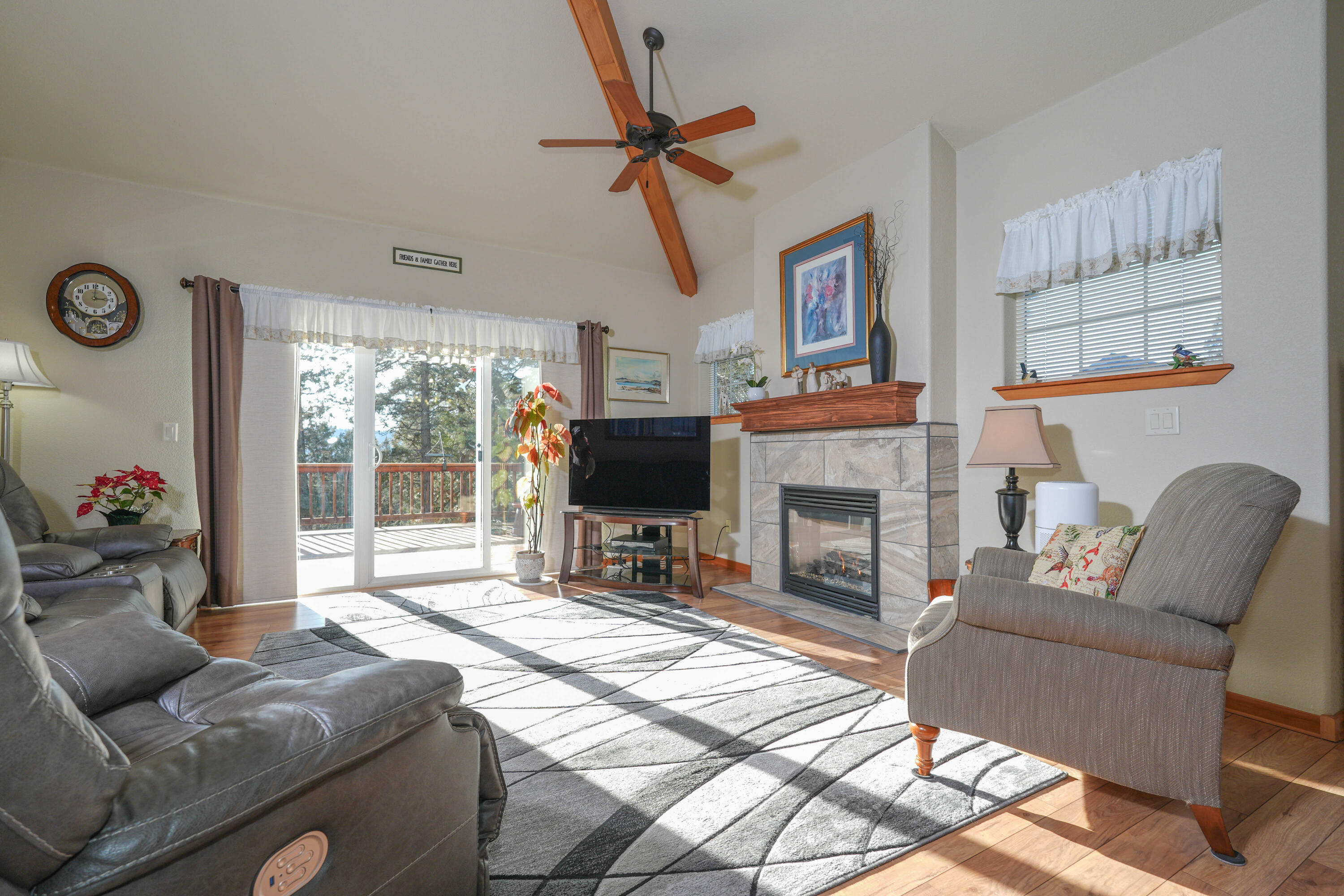 5028 Sora Loop Klamath Falls, OR 97601 - Photo 24 of 62 a living room with furniture a flat screen tv and a fireplace