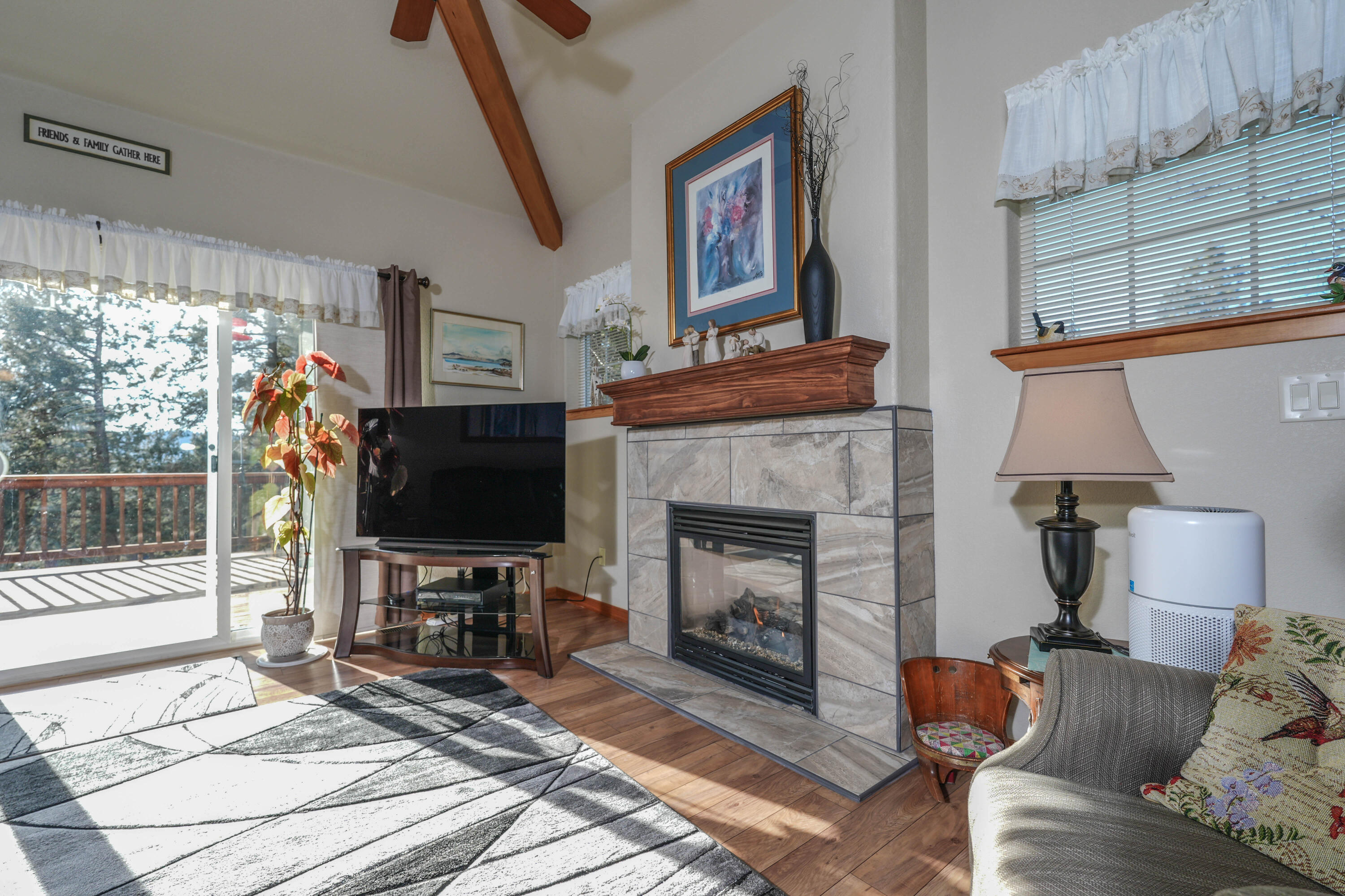 5028 Sora Loop Klamath Falls, OR 97601 - Photo 25 of 62 a living room with furniture a flat screen tv and a fireplace