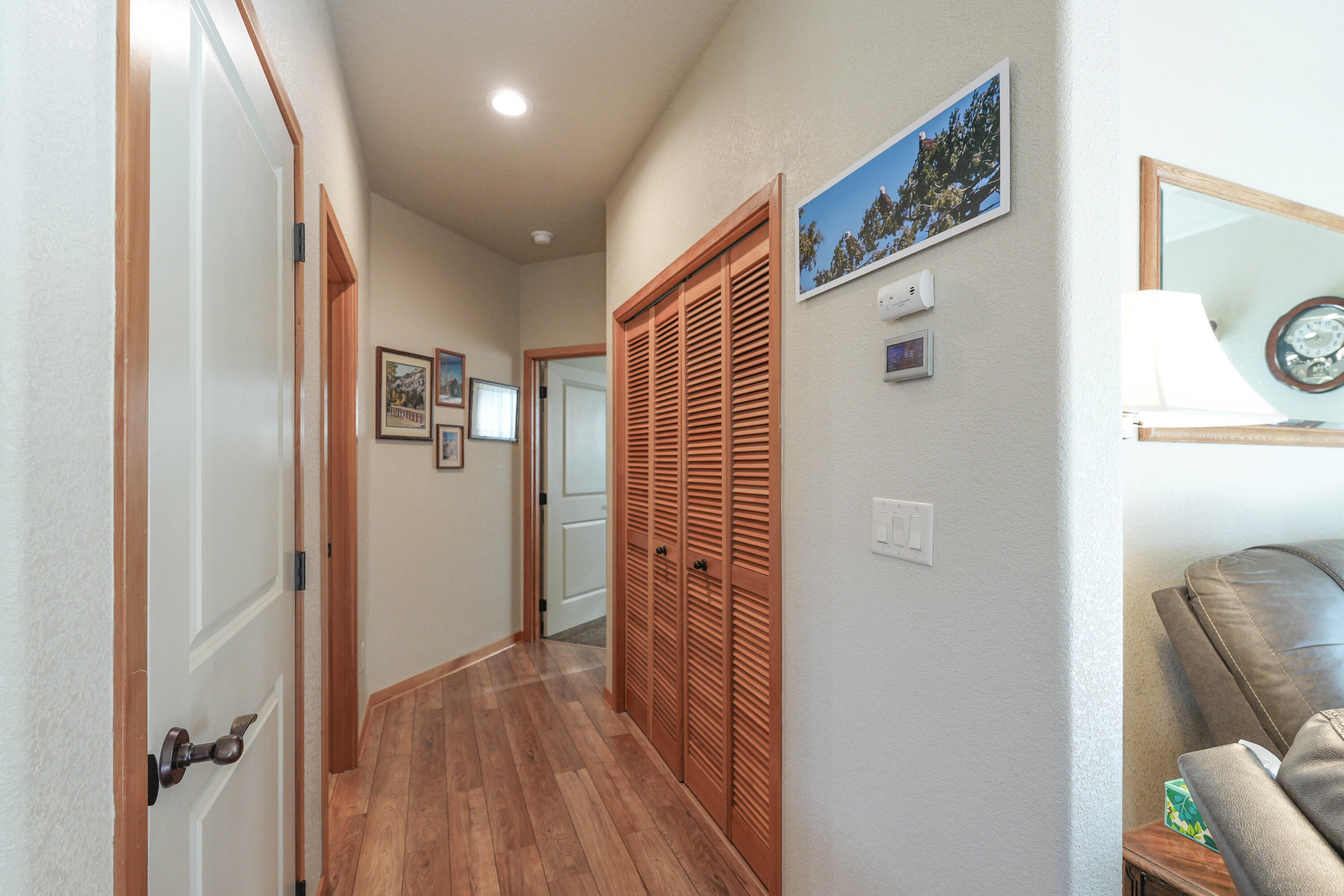 5028 Sora Loop Klamath Falls, OR 97601 - Photo 28 of 62 a view of a hallway with wooden floor and bathroom