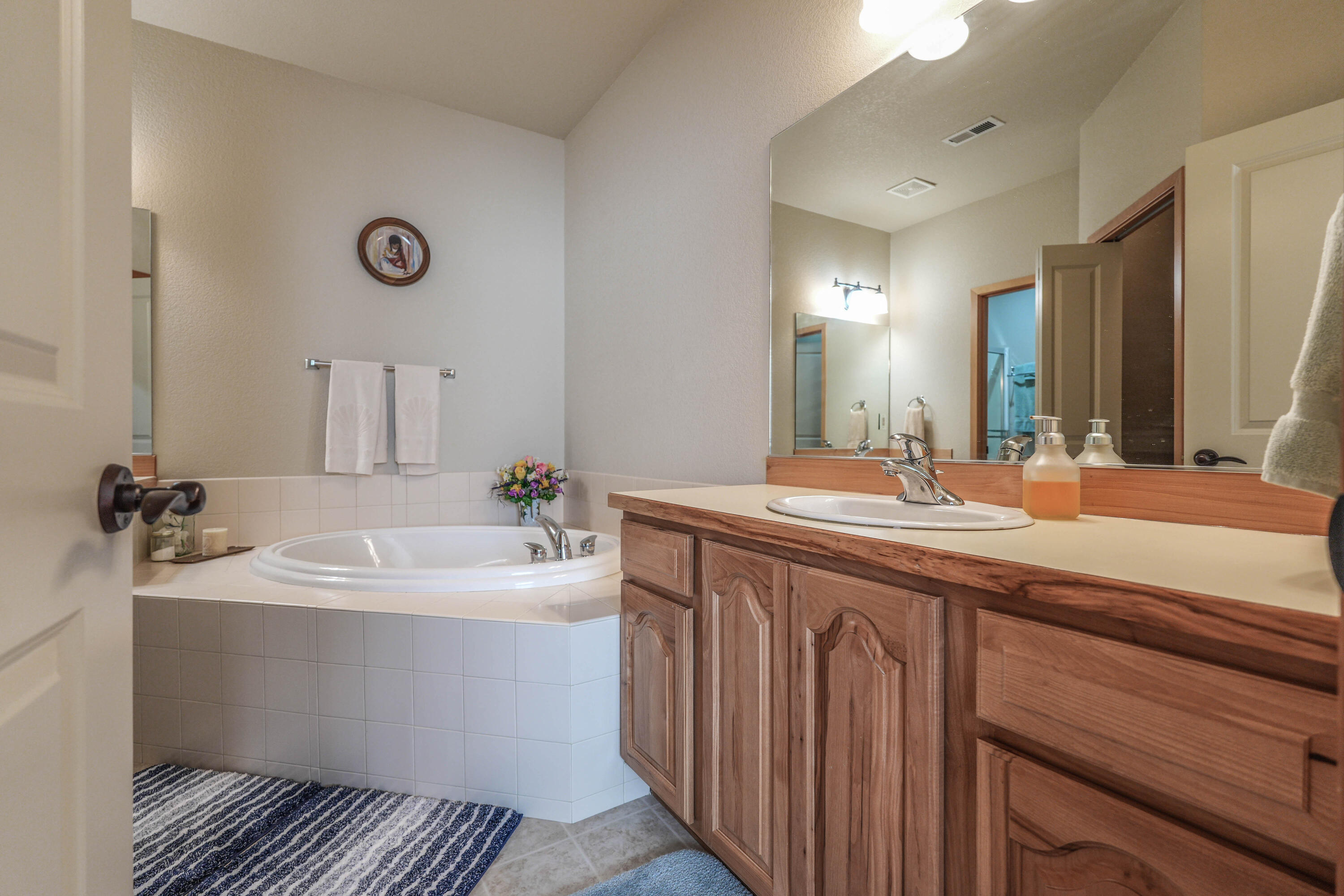 5028 Sora Loop Klamath Falls, OR 97601 - Photo 42 of 62 a bathroom with a double vanity sink and mirror