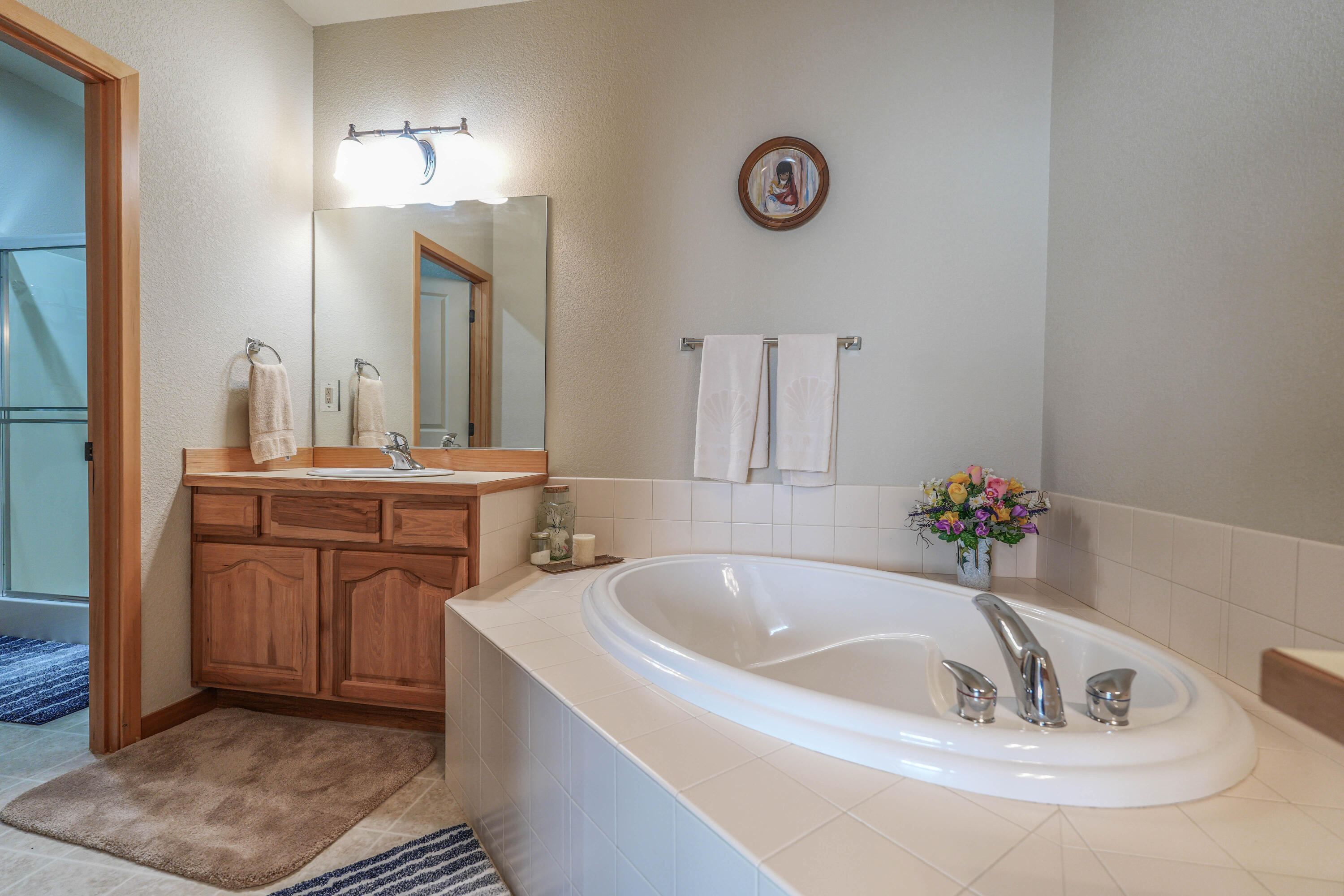 5028 Sora Loop Klamath Falls, OR 97601 - Photo 43 of 62 a bathroom with a tub sink and mirror