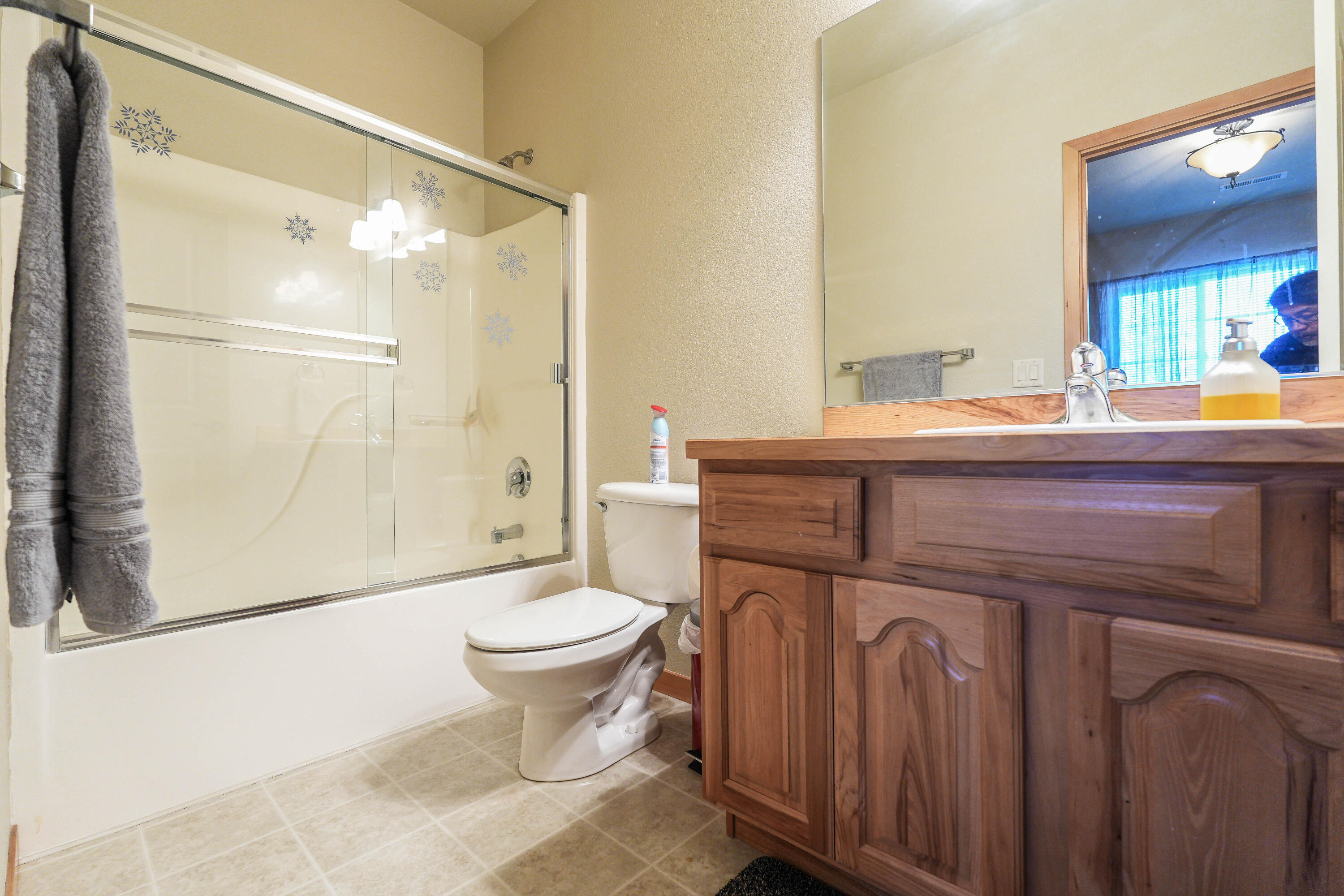 5028 Sora Loop Klamath Falls, OR 97601 - Photo 49 of 62 a bathroom with a sink a toilet a mirror and shower