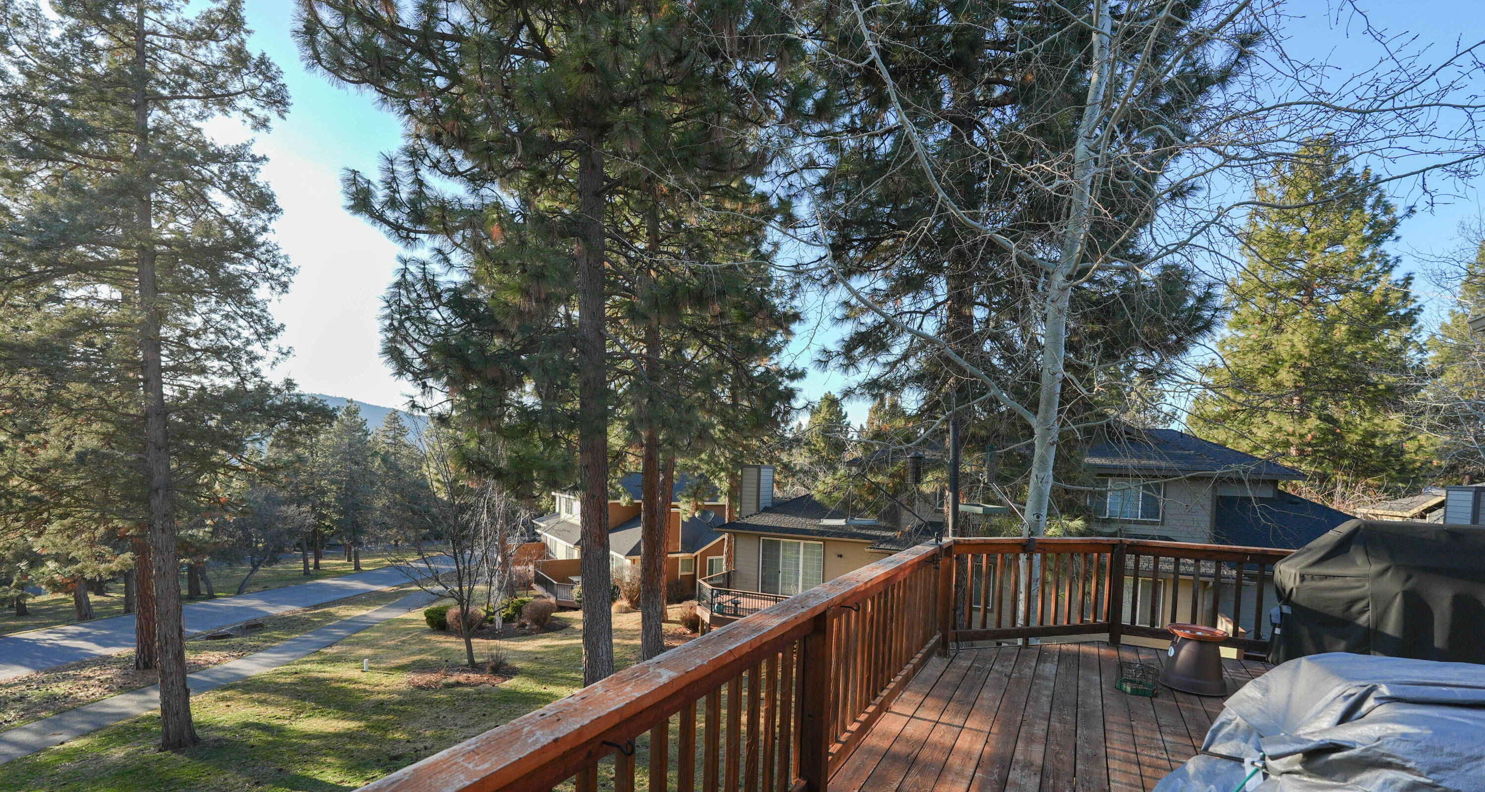 5028 Sora Loop Klamath Falls, OR 97601 - Photo 58 of 62 a view of a balcony with wooden floor and trees