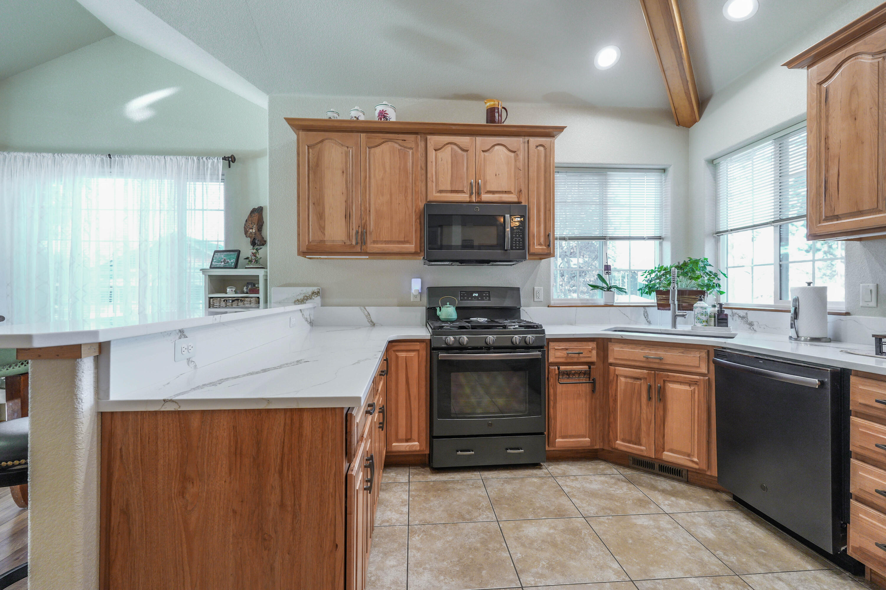 5028 Sora Loop Klamath Falls, OR 97601 - Photo 9 of 62 a kitchen with stainless steel appliances granite countertop a sink and a stove