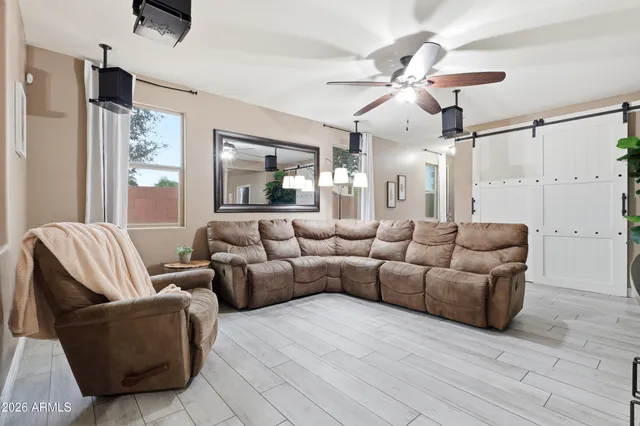 a kitchen with a refrigerator a sink and white cabinets