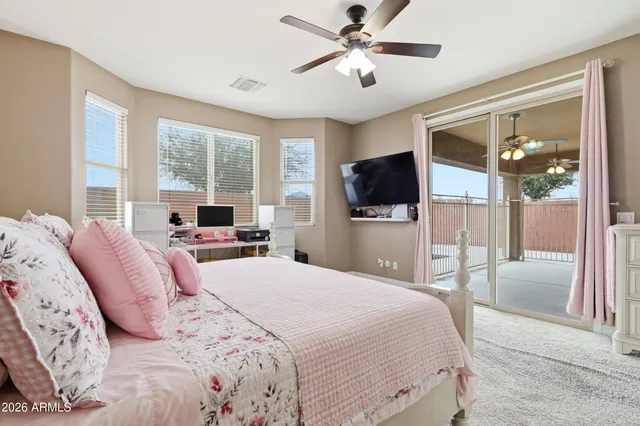 a bathroom with double vanity white cabinets