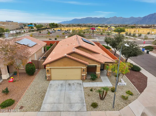 an aerial view of a house with a garden
