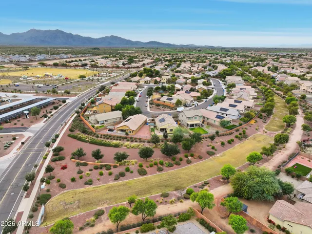 a view of outdoor space with building and trees in the background