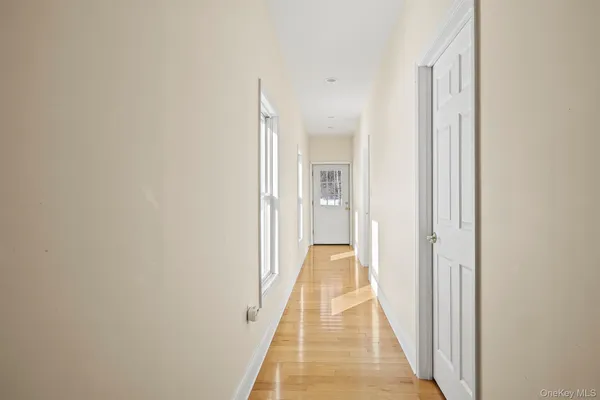 a view of entryway with wooden floor
