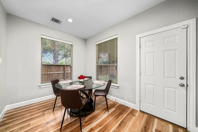 a view of a dining room with furniture window and outside view