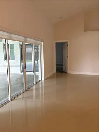 an empty room with glass door