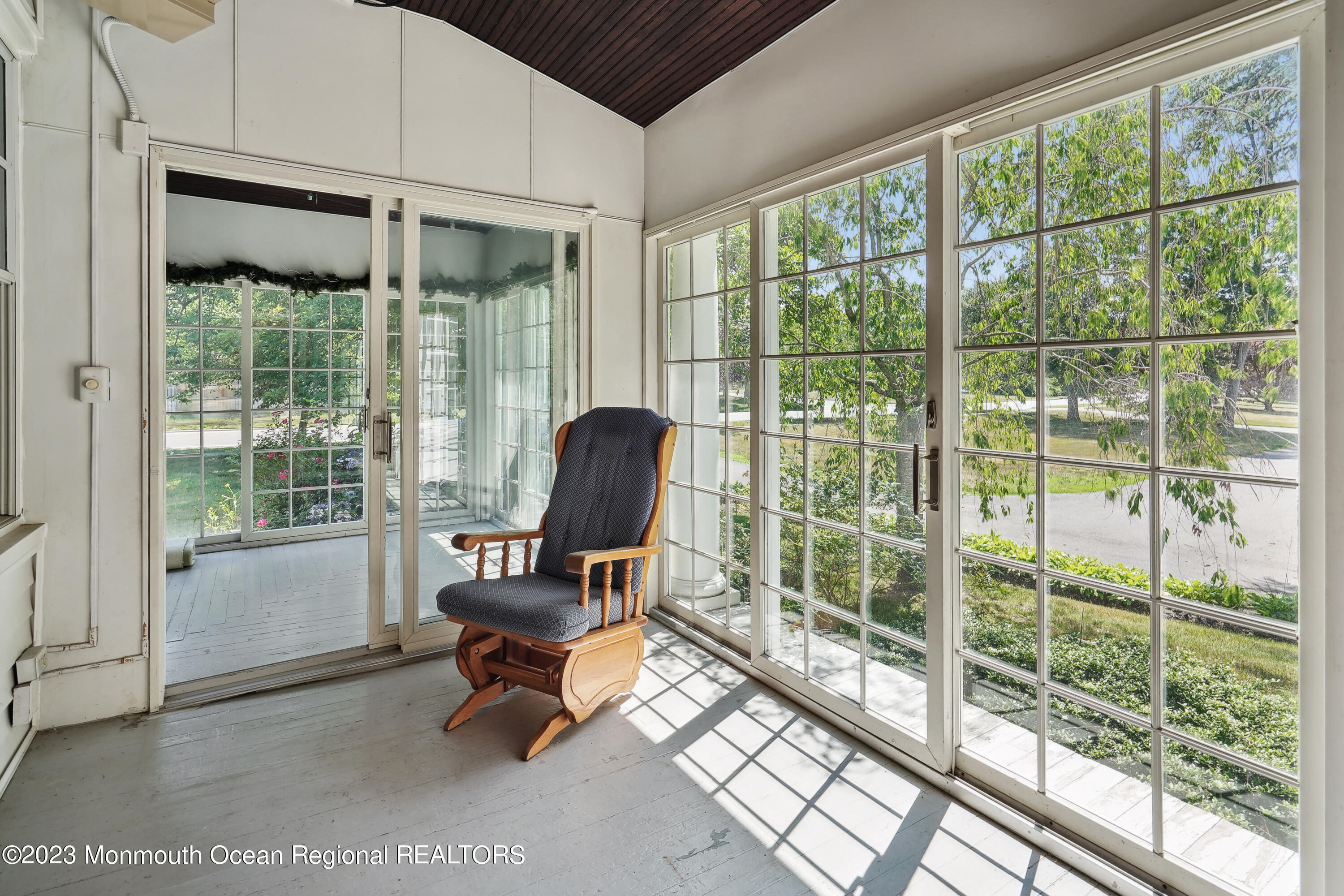 51 Cherry Tree Farm Road Middletown, NJ 07748 - Photo 22 of 62 a living room with furniture and a floor to ceiling window