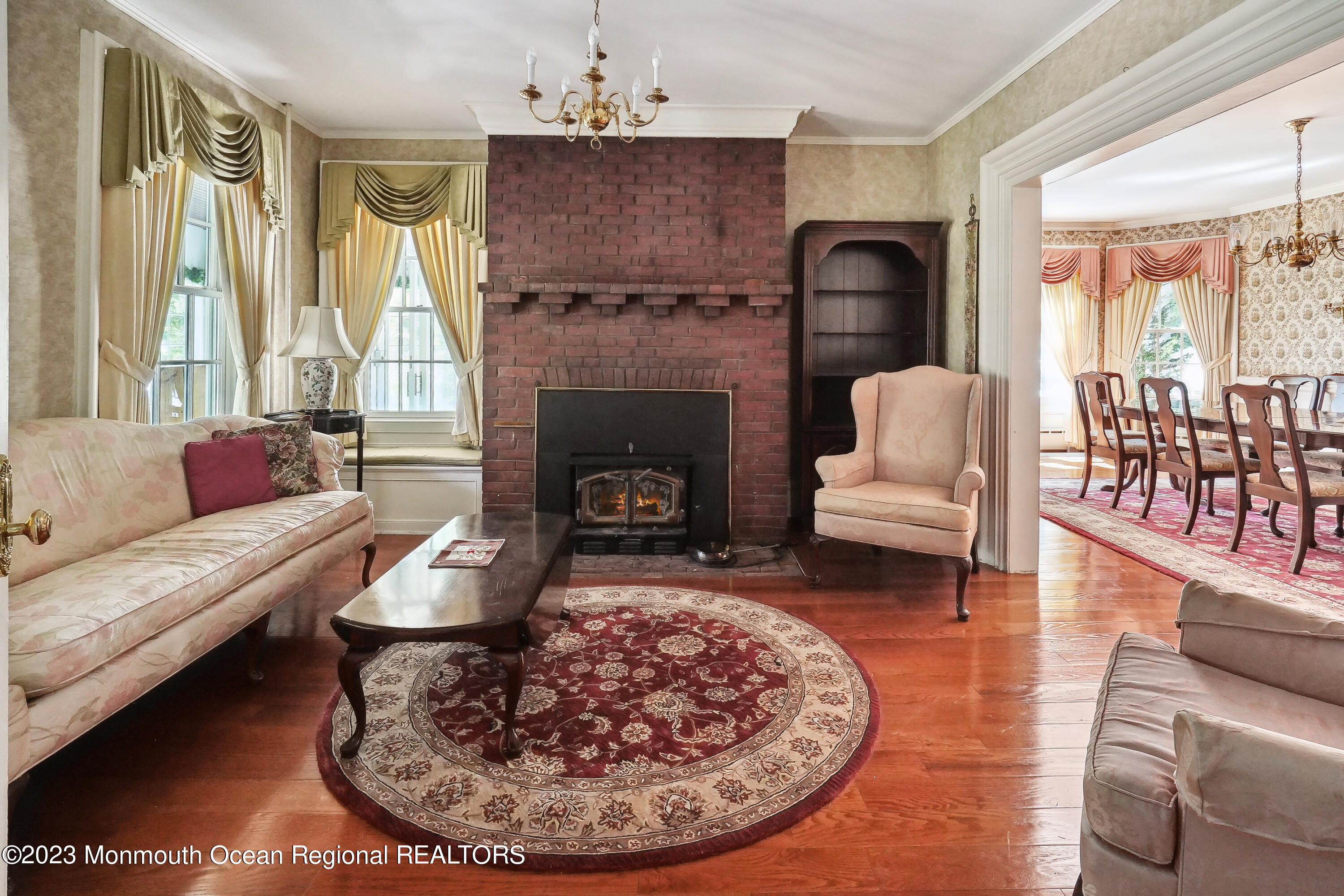 51 Cherry Tree Farm Road Middletown, NJ 07748 - Photo 27 of 62 a living room with furniture and a fireplace