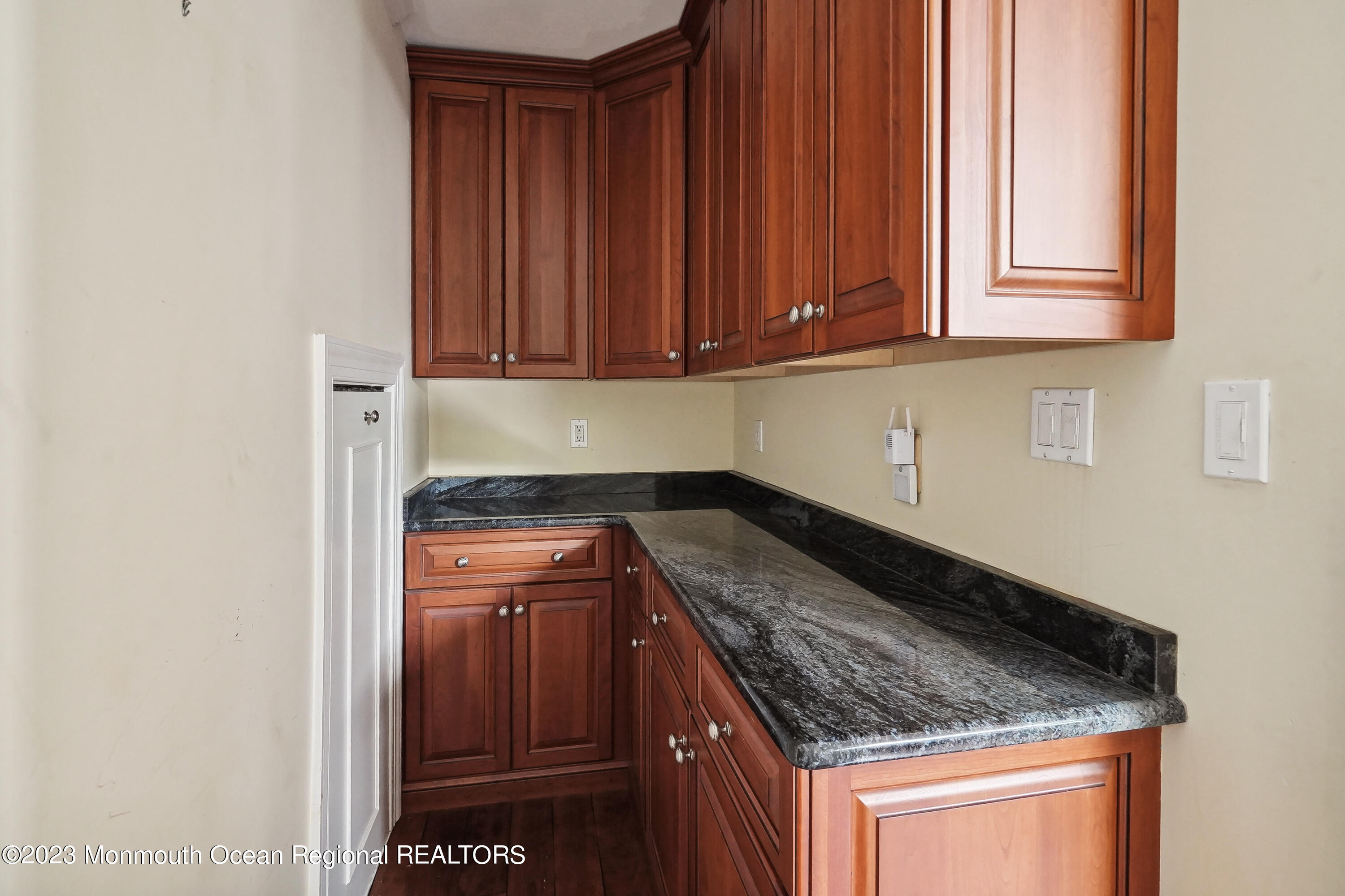 51 Cherry Tree Farm Road Middletown, NJ 07748 - Photo 30 of 62 a kitchen with granite countertop cabinets and utility