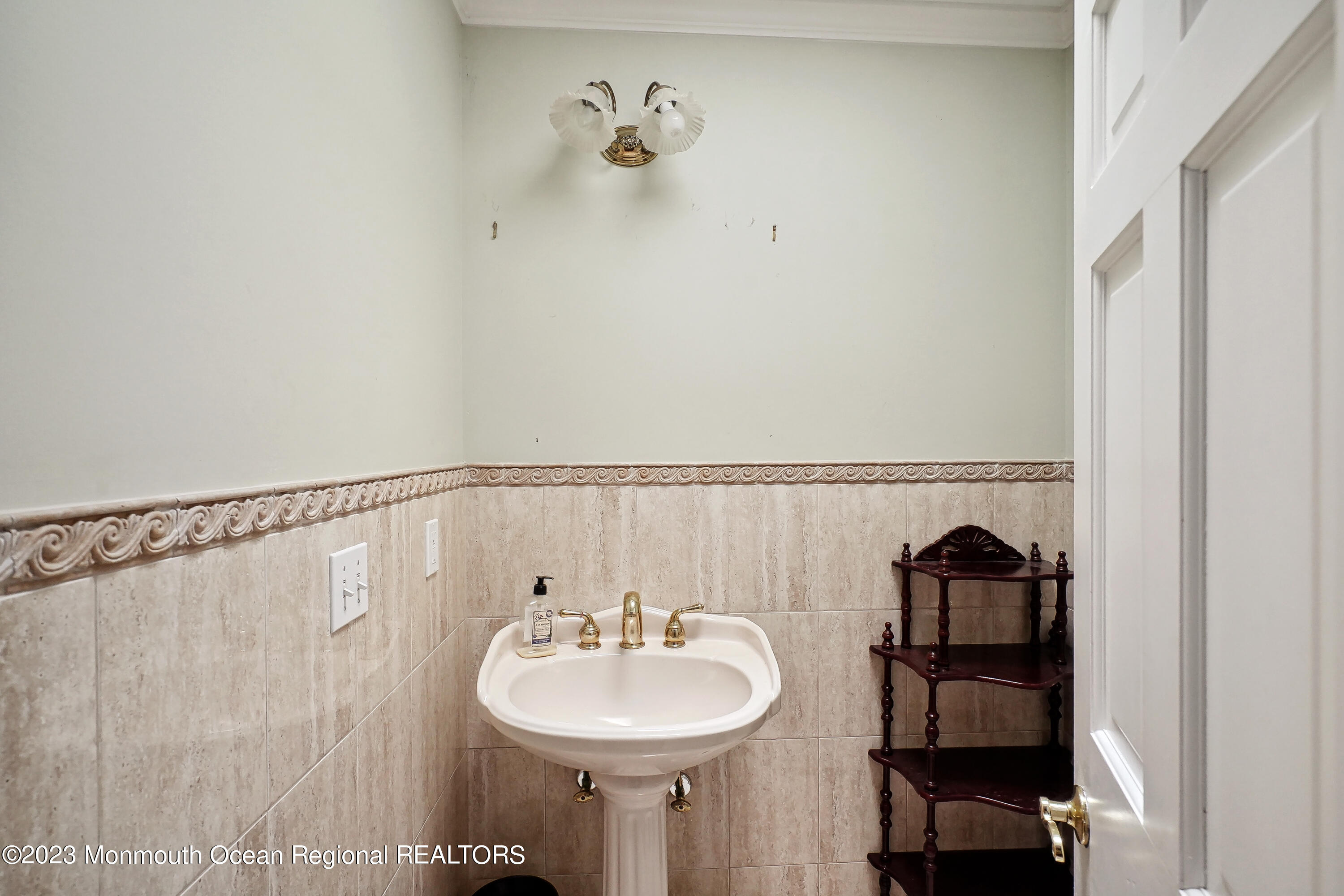 51 Cherry Tree Farm Road Middletown, NJ 07748 - Photo 38 of 62 a bathroom with a sink and a mirror