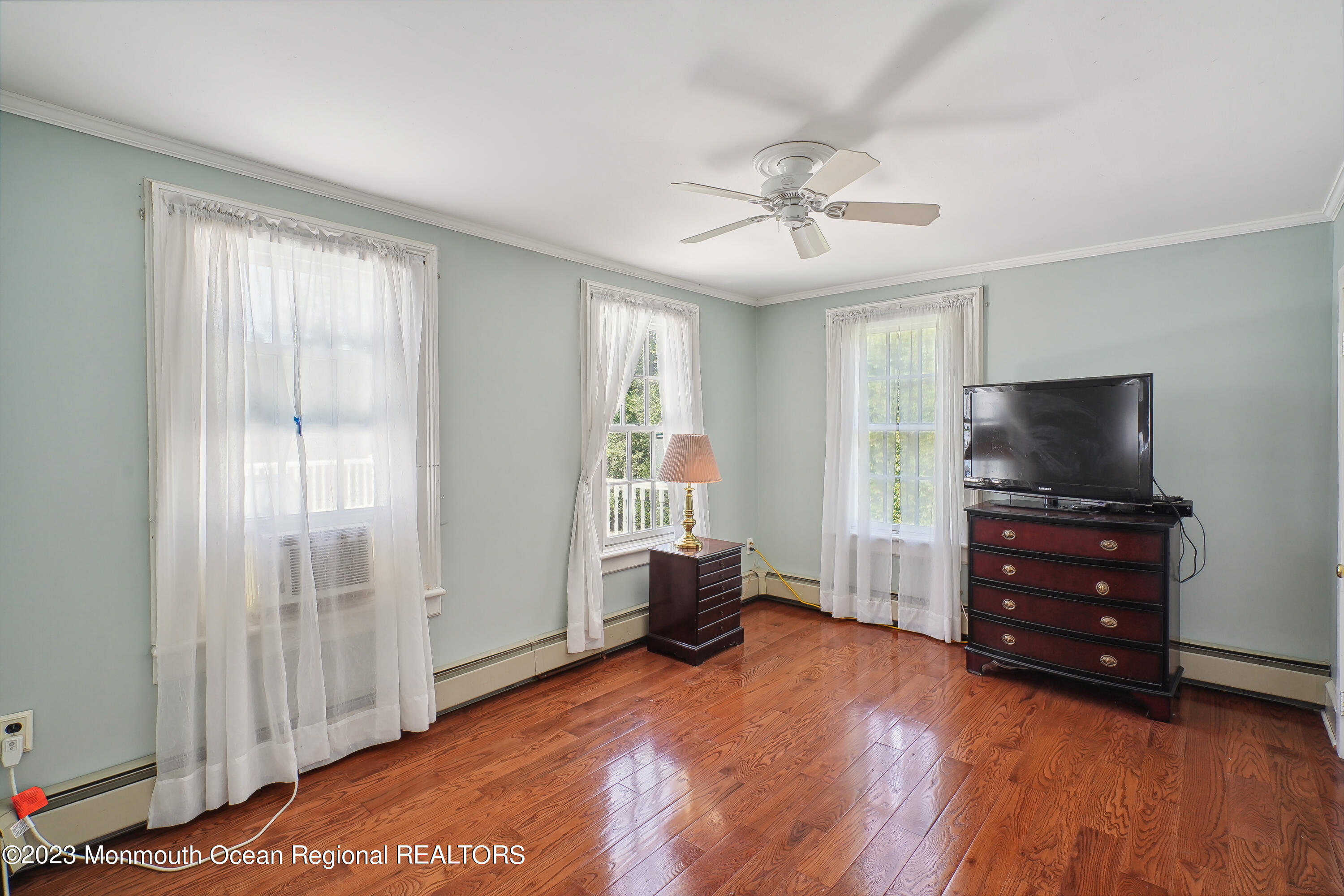 51 Cherry Tree Farm Road Middletown, NJ 07748 - Photo 41 of 62 a living room with furniture and a flat screen tv
