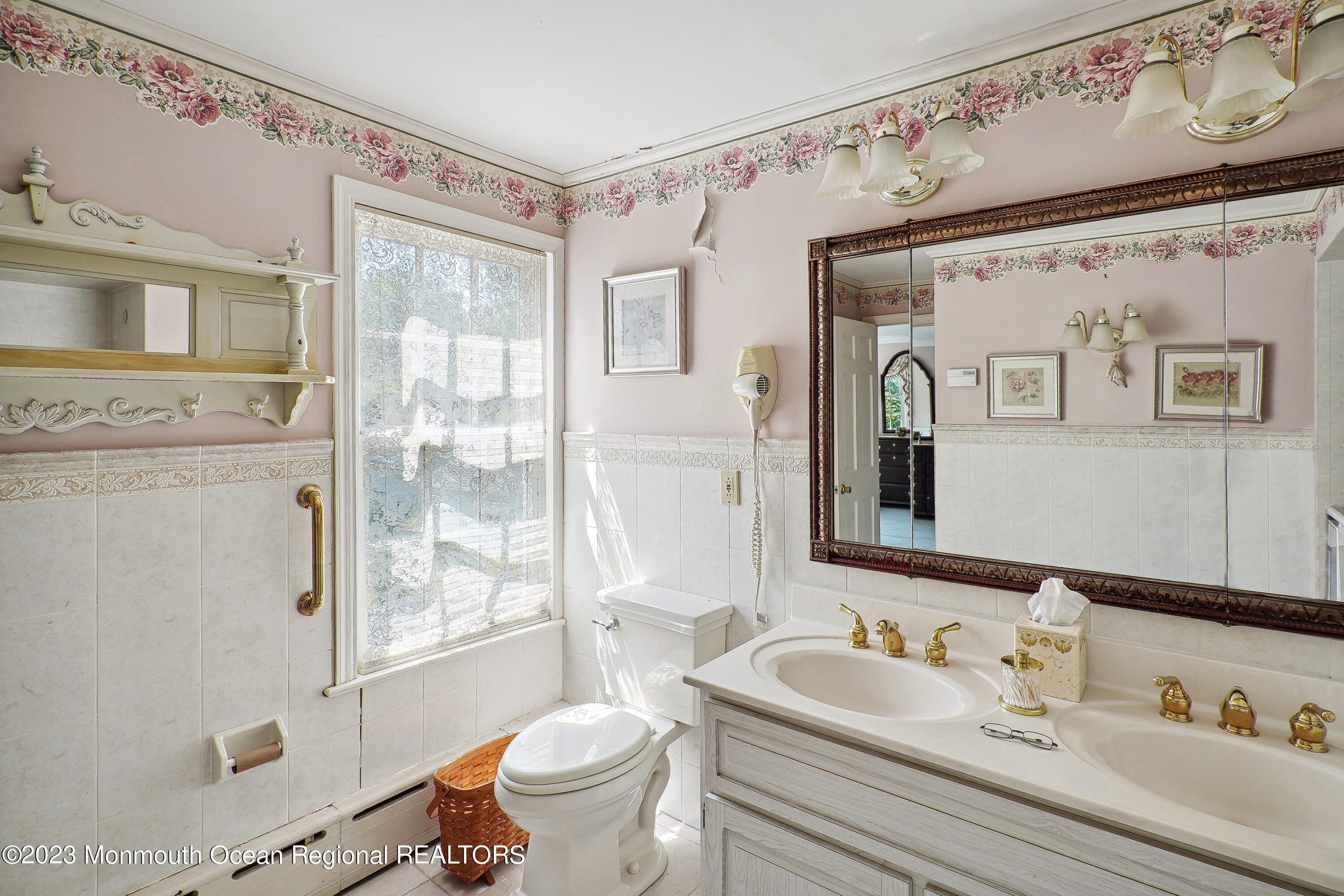 51 Cherry Tree Farm Road Middletown, NJ 07748 - Photo 47 of 62 a bathroom with a granite countertop sink and a mirror