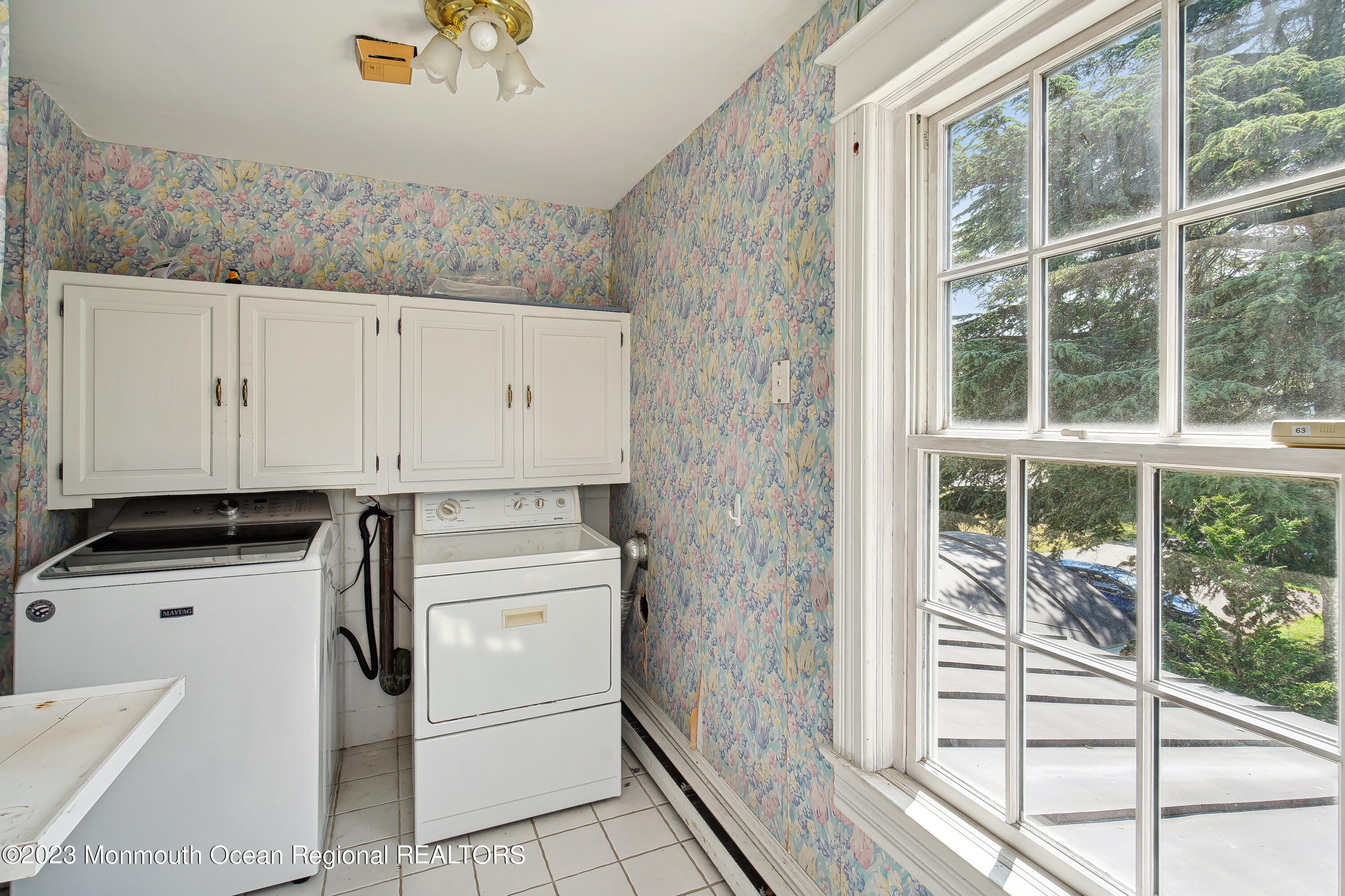 51 Cherry Tree Farm Road Middletown, NJ 07748 - Photo 48 of 62 a kitchen with granite countertop a refrigerator a stove a sink and white cabinets with wooden floor