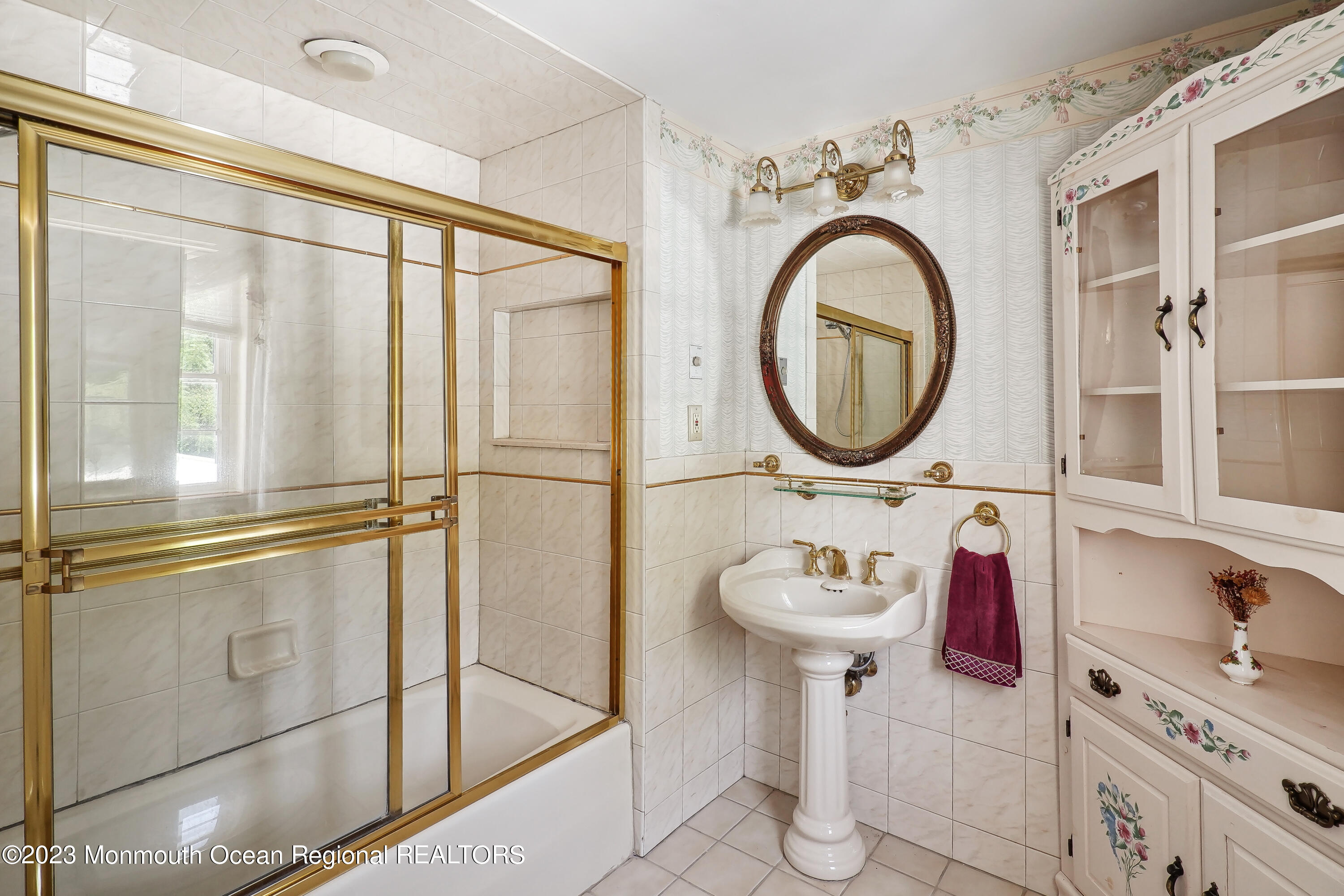 51 Cherry Tree Farm Road Middletown, NJ 07748 - Photo 49 of 62 a bathroom with a sink and a mirror