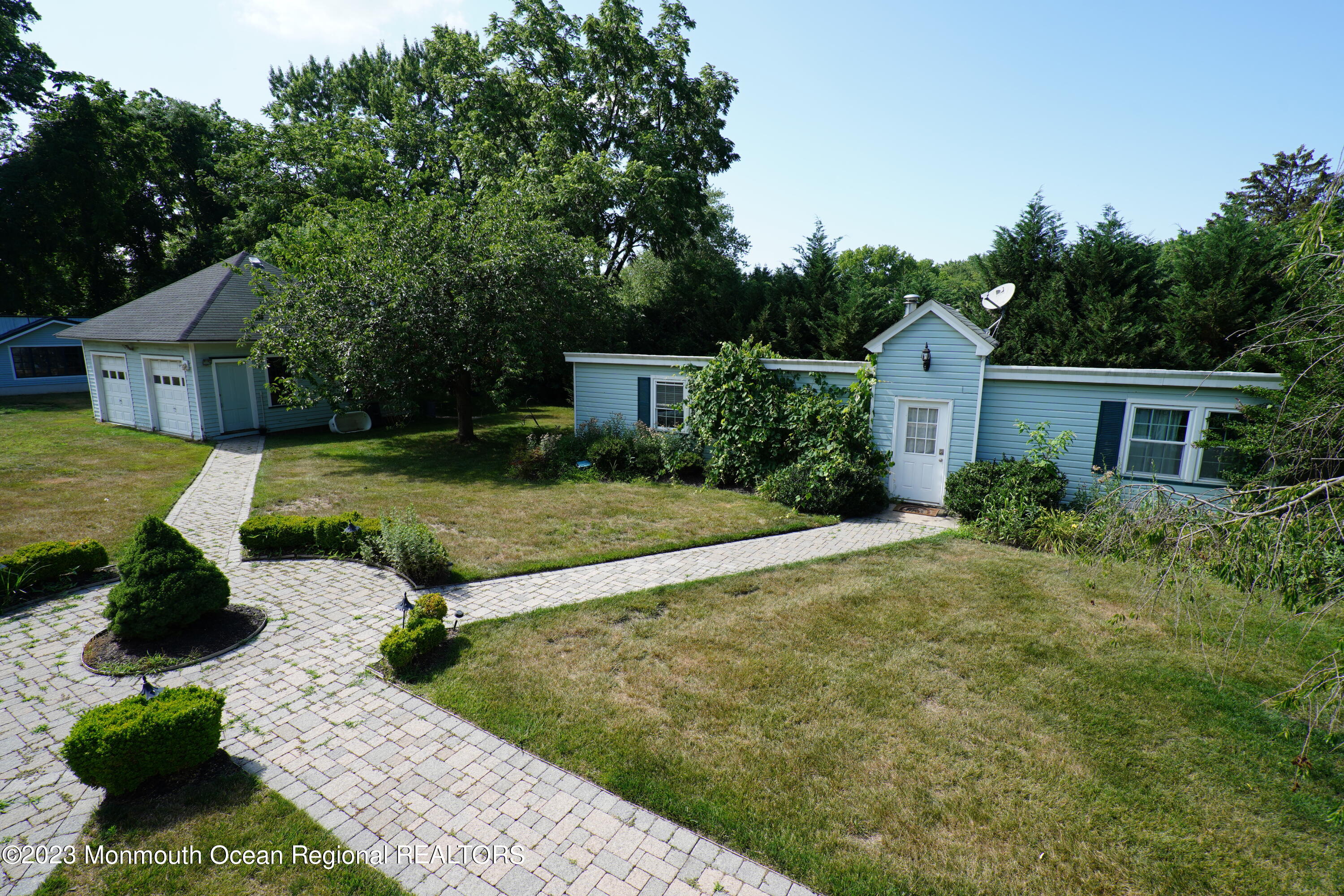 51 Cherry Tree Farm Road Middletown, NJ 07748 - Photo 51 of 62 a front view of a house with garden