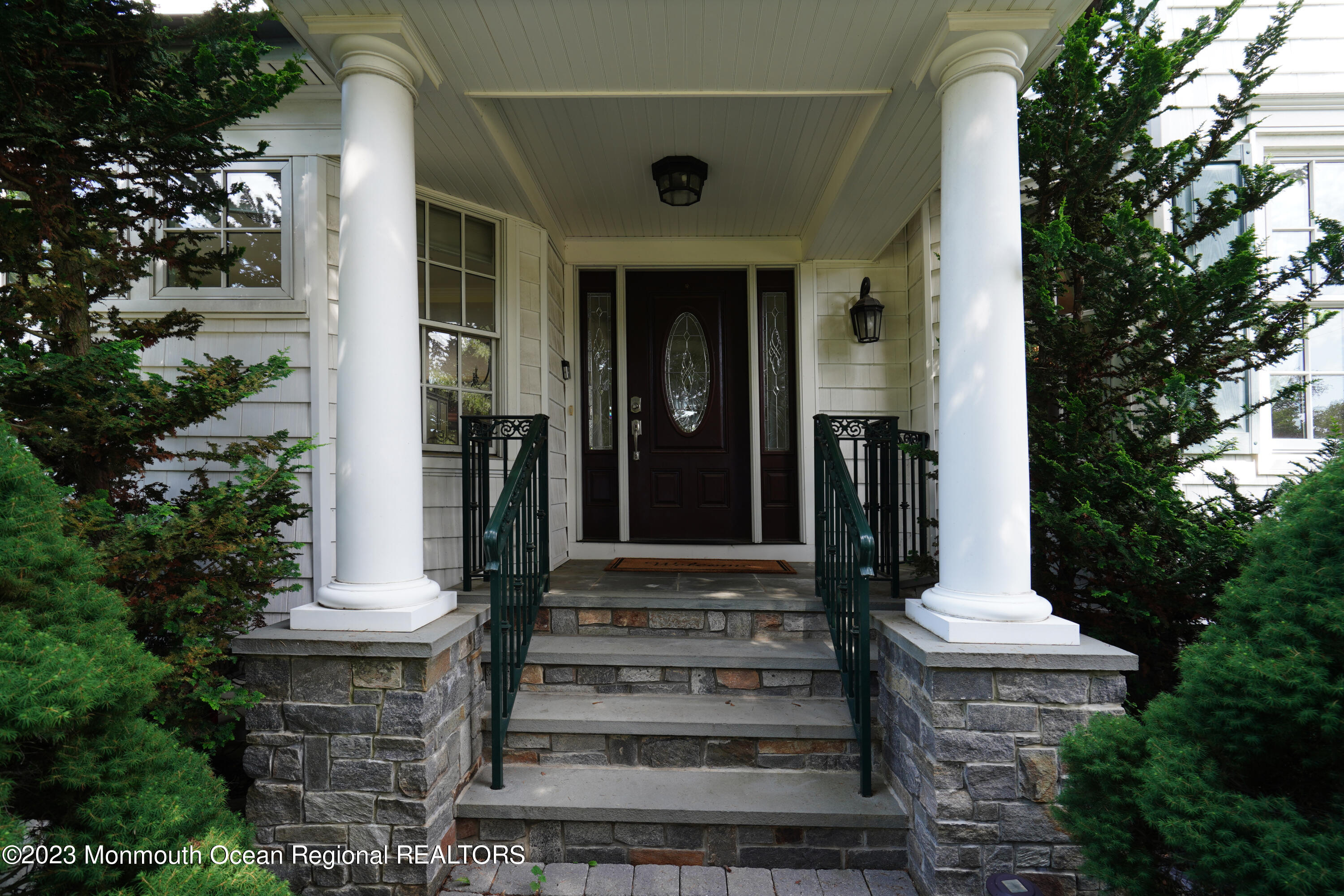 51 Cherry Tree Farm Road Middletown, NJ 07748 - Photo 7 of 62 a front view of a house with a fountain