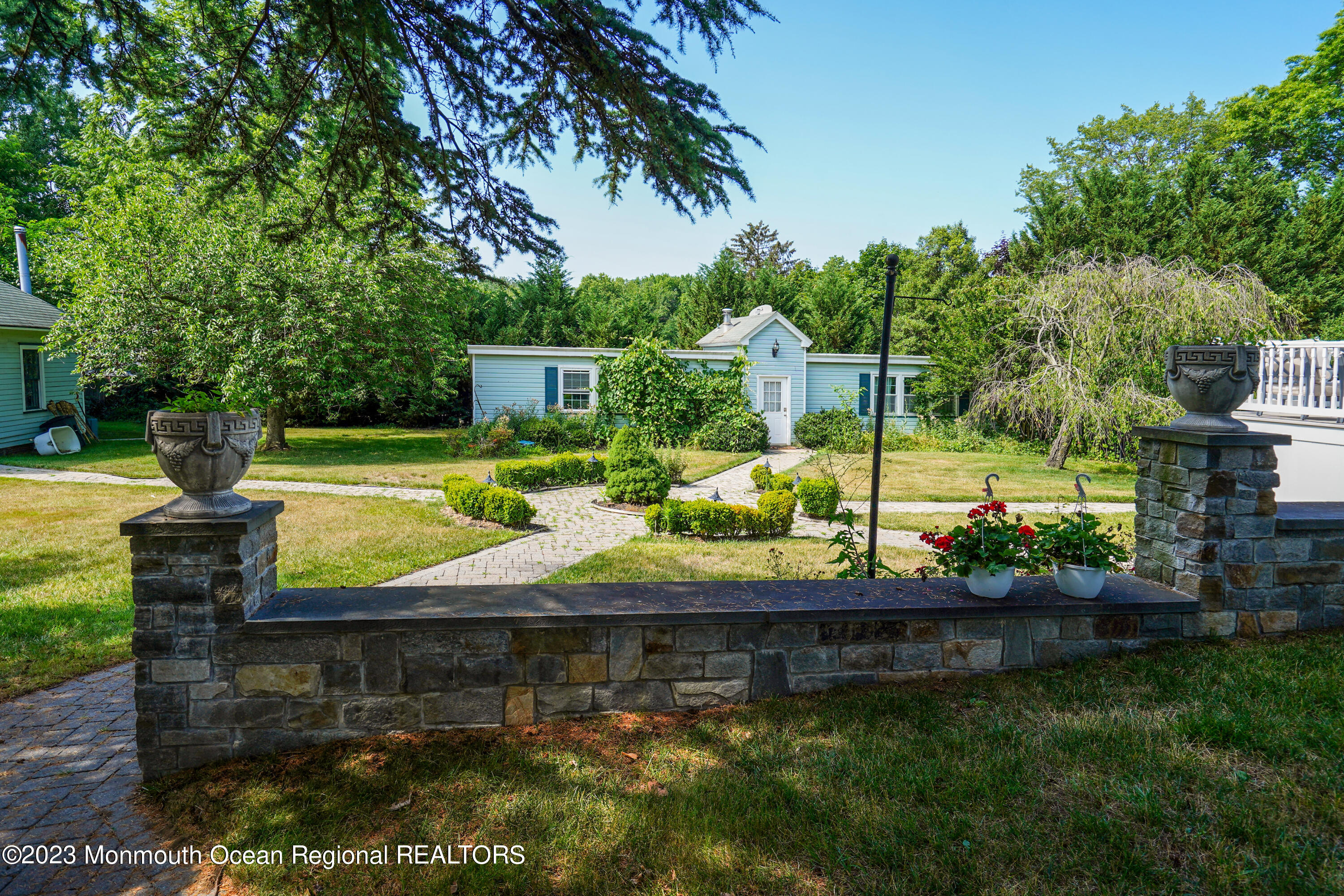 51 Cherry Tree Farm Road Middletown, NJ 07748 - Photo 9 of 62 a view of a yard with plants