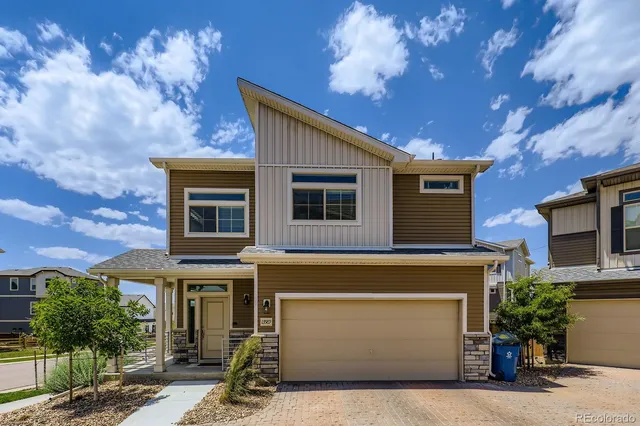 a front view of a house with yard