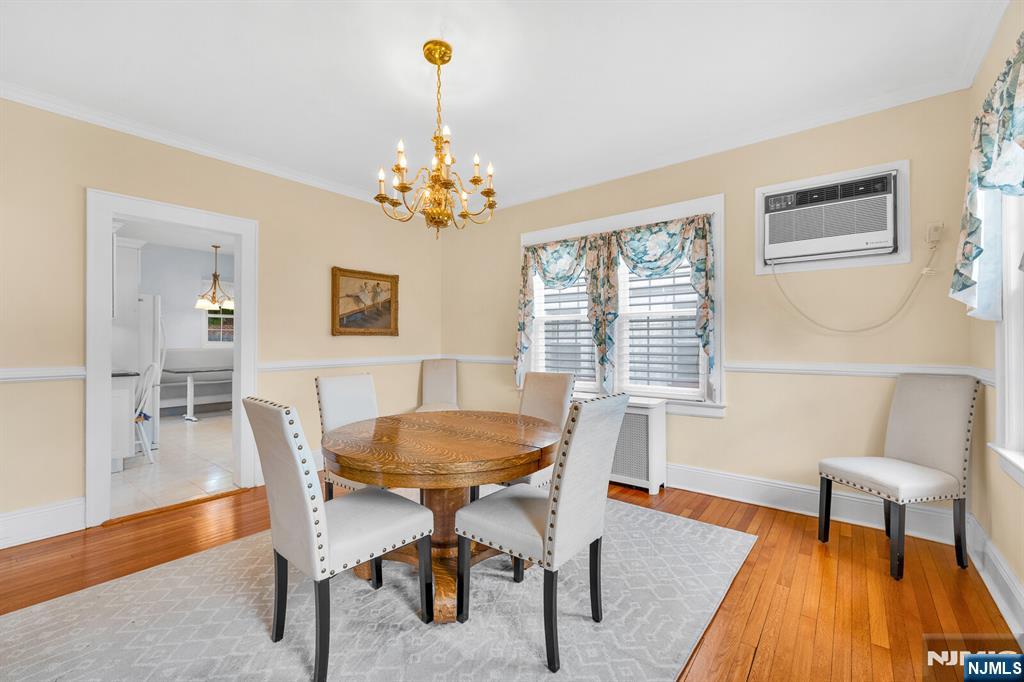 106 Maple Street Rutherford, NJ 07070 - Photo 15 of 50 a view of a dining room with furniture wooden floor and a chandelier
