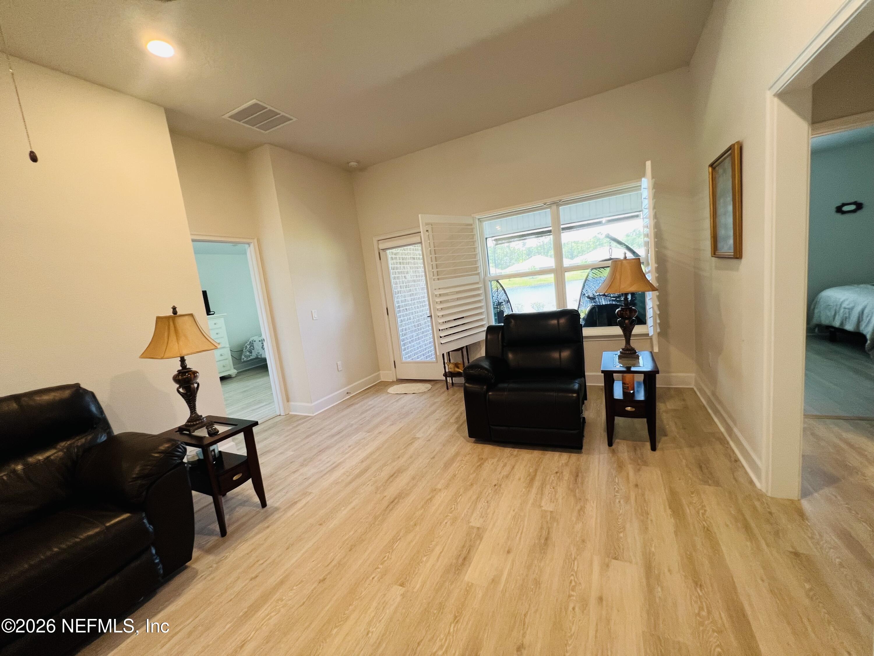 2 Rivertown Road Palm Coast, FL 32137 - Photo 53 of 80 a living room with furniture and a wooden floor