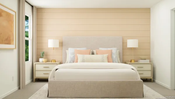 a bedroom with a bed and a window