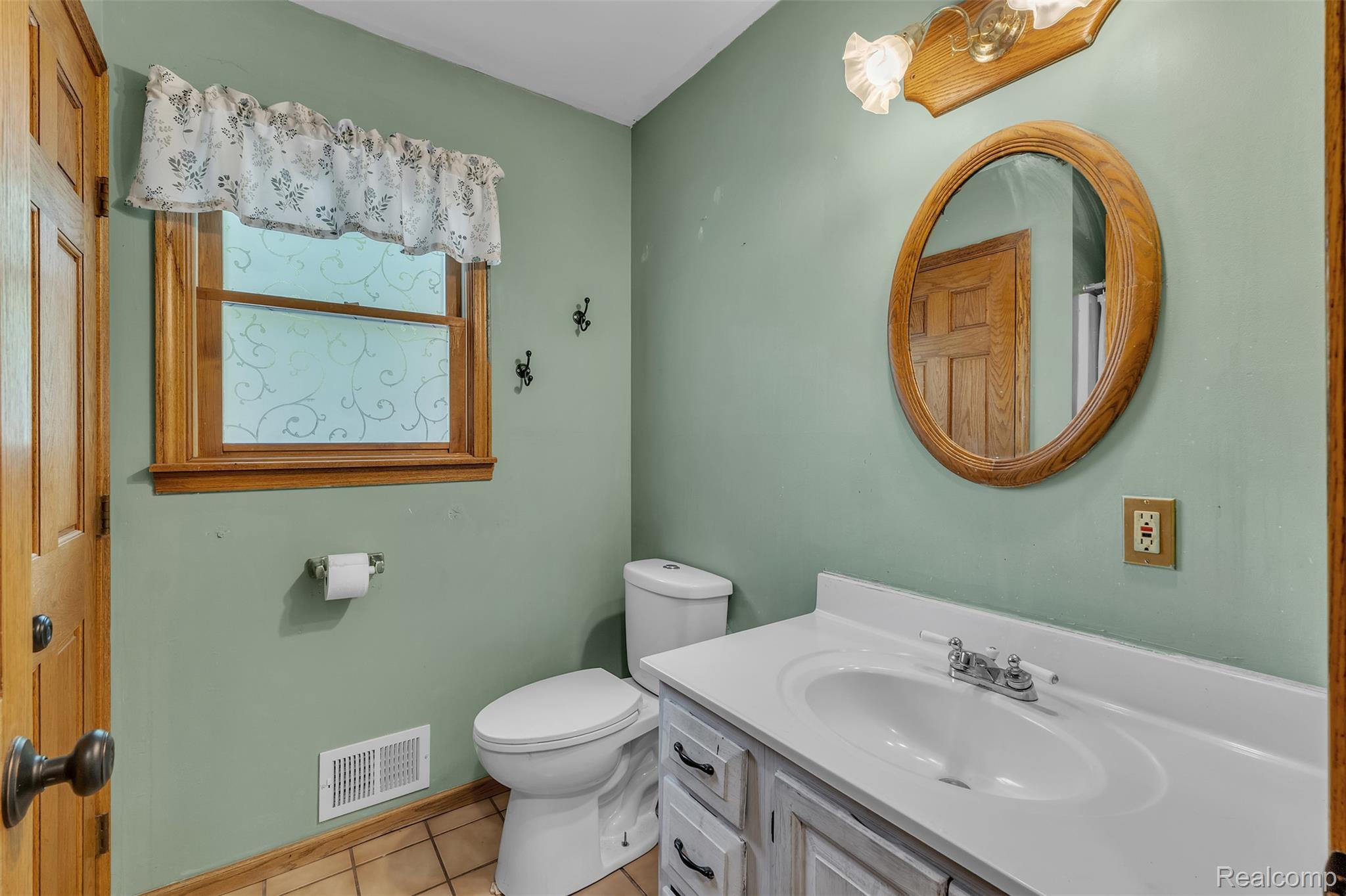 1345 Ives Road Mason, MI 48854 - Photo 25 of 92 Full bathroom featuring vanity, light tile patterned floors, and a shower with curtain