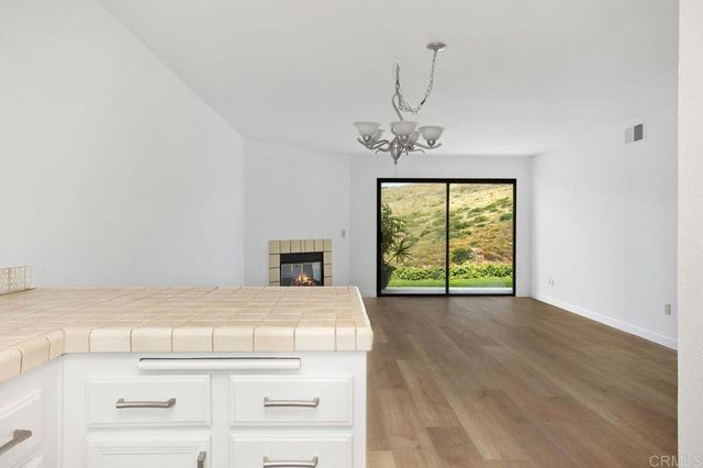 a view of a kitchen with a sink and dishwasher