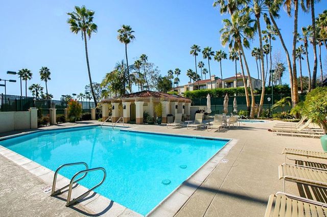 a view of swimming pool with chairs