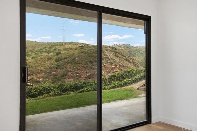 a view of a room with a large window