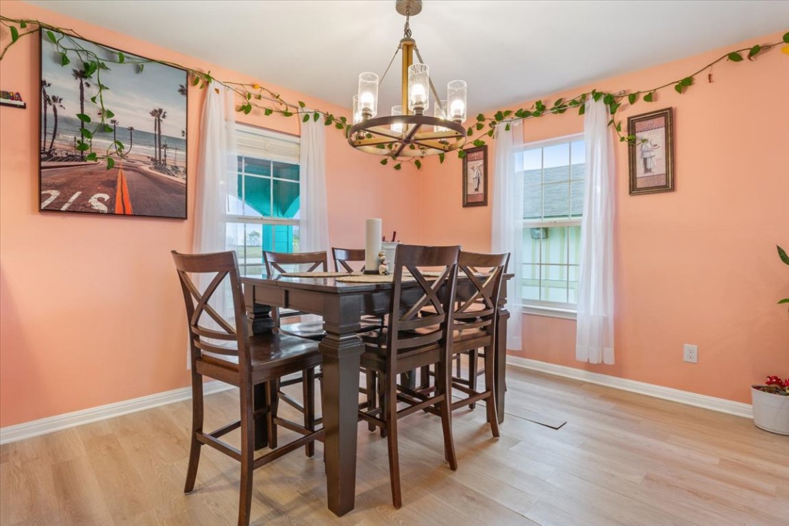 50 Dusty Dam Road Coupland, TX 78615 - Photo 14 of 38 The dining area provides a comfortable space for shared meals and conversation. Its location near the kitchen allows for easy serving and cleanup.