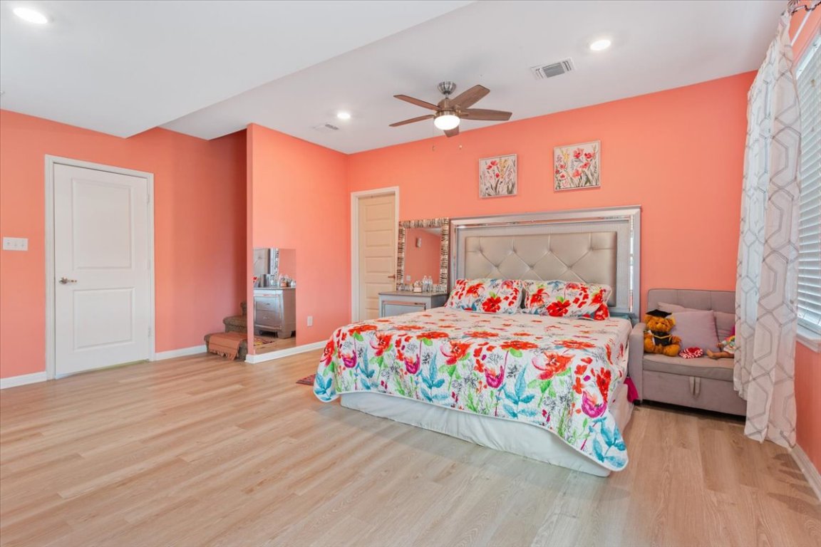 50 Dusty Dam Road Coupland, TX 78615 - Photo 15 of 38 The primary bedroom offers a relaxing retreat within the main residence.