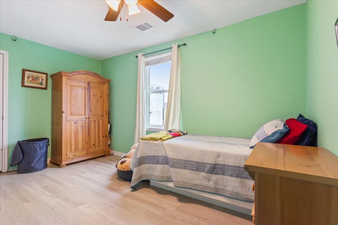 50 Dusty Dam Road Coupland, TX 78615 - Photo 20 of 38 The secondary bedrooms are versatile and spacious, ideal for family members, guests, or home office use.