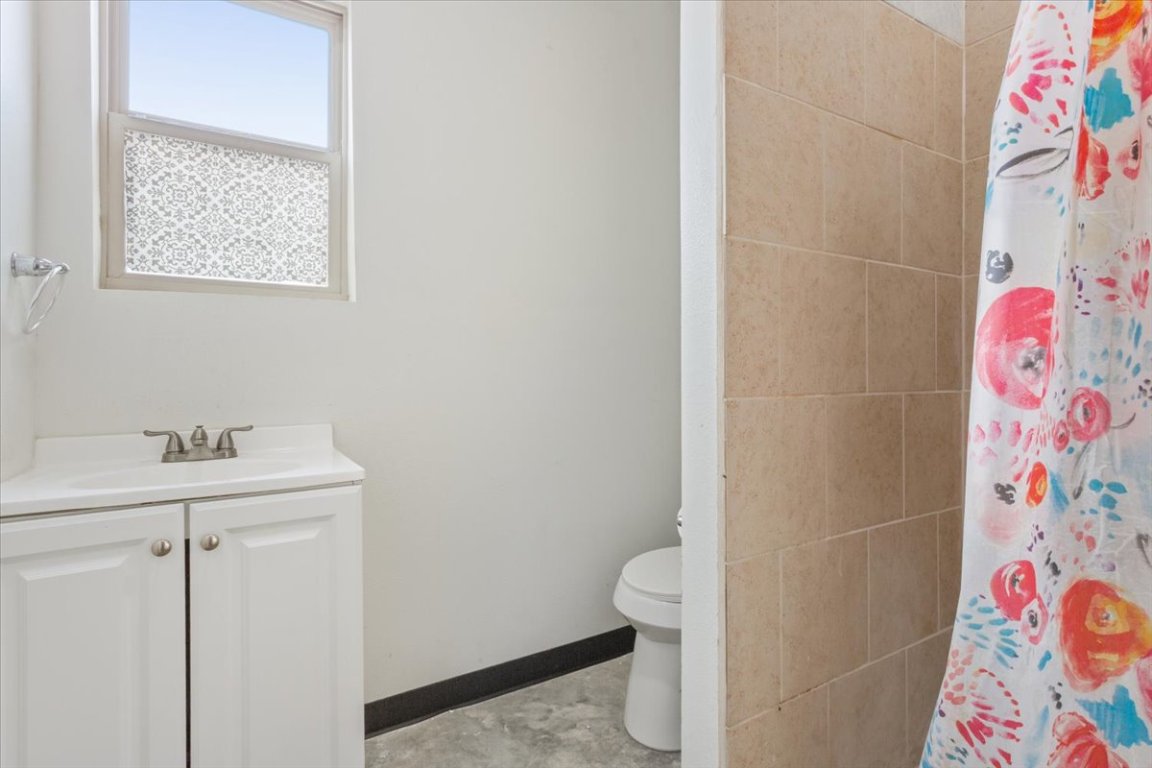 50 Dusty Dam Road Coupland, TX 78615 - Photo 27 of 38 Each bathroom is designed with functionality in mind. Neutral finishes make the spaces easy to maintain and personalize.